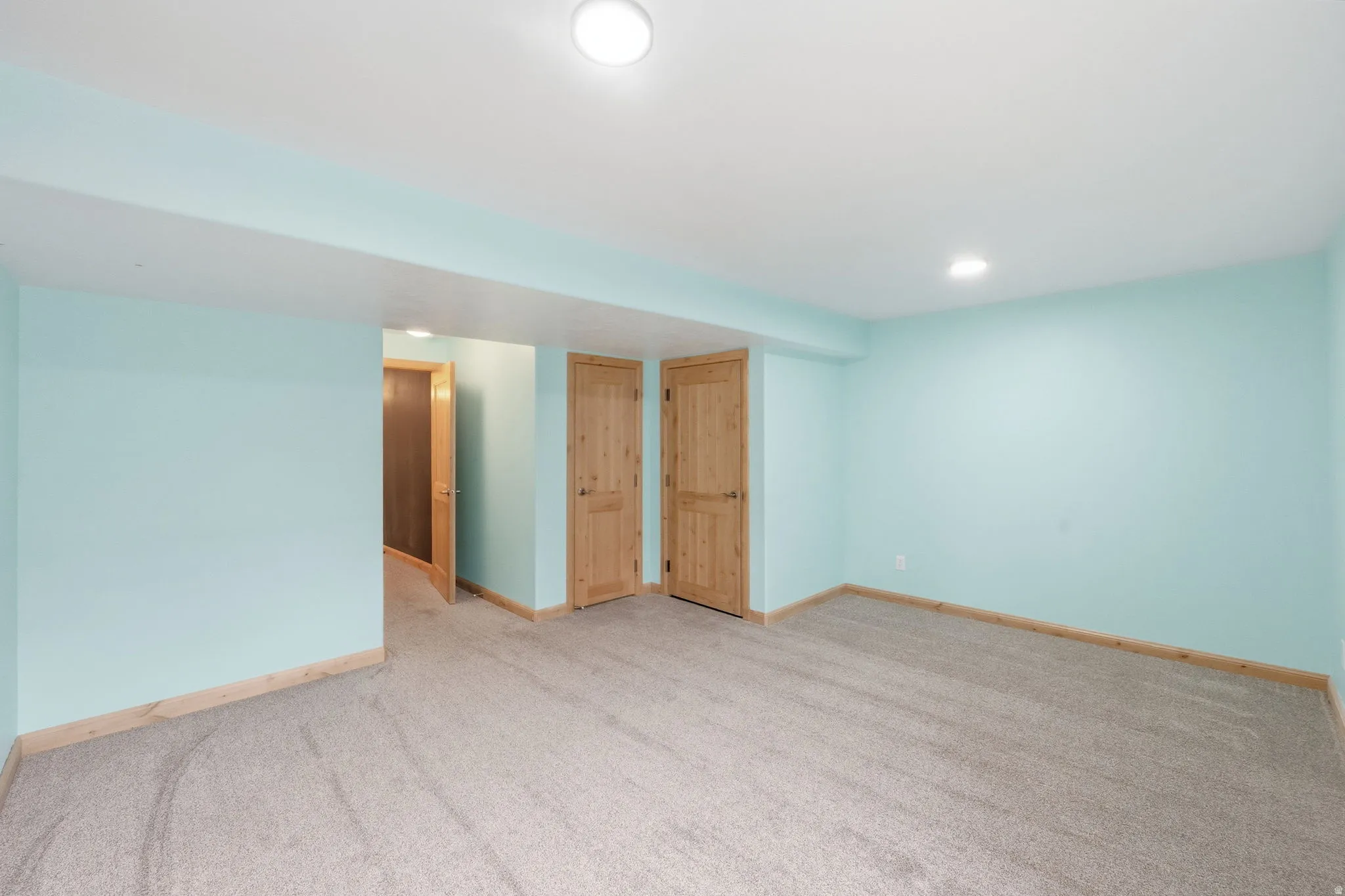 Unfurnished room with carpet floors and recessed lighting