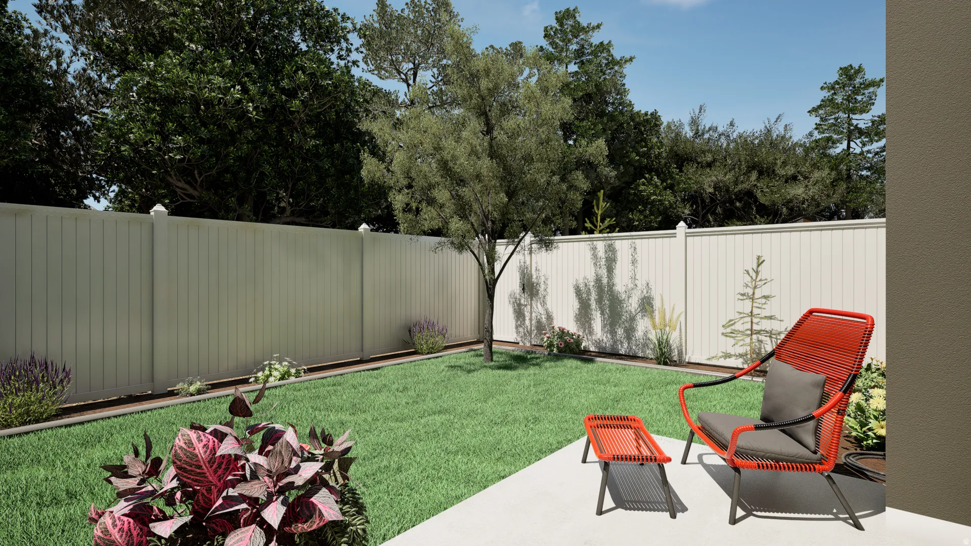 Private backyard featuring a manicured lawn, established landscaping, and a substantial privacy fence