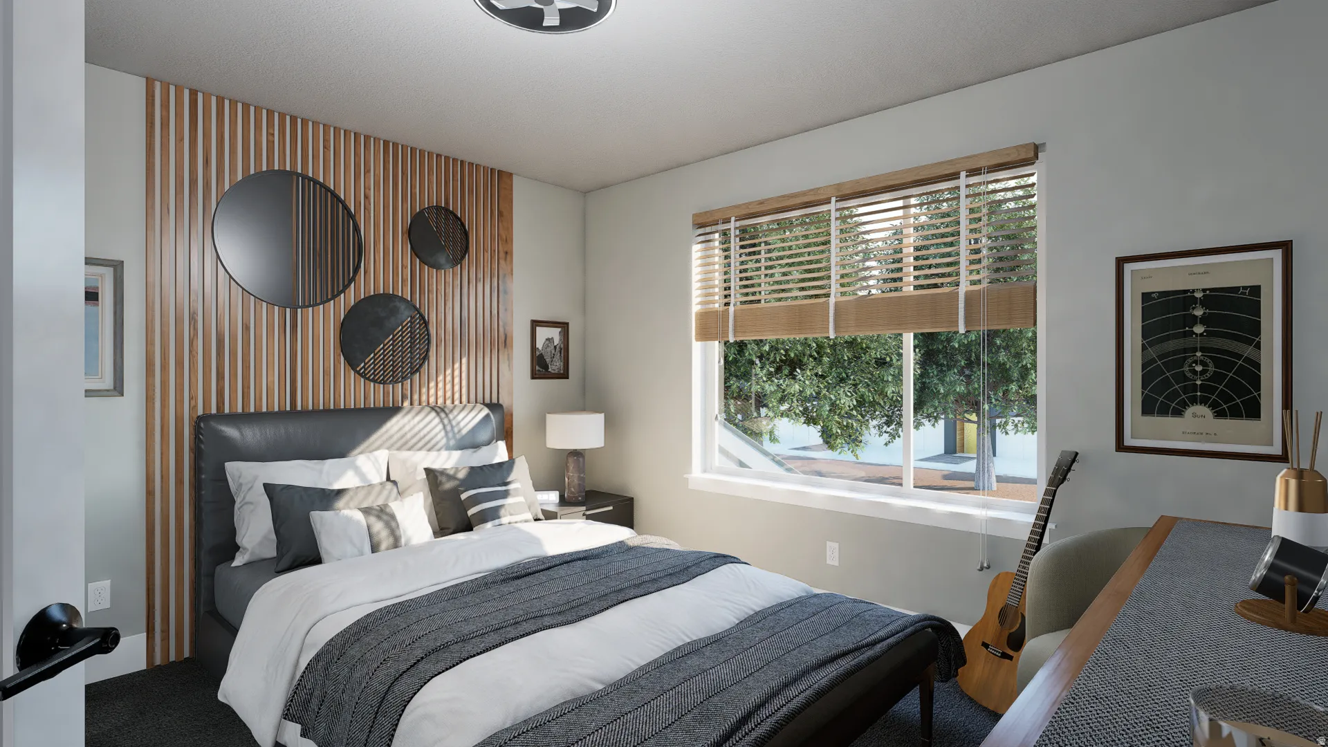 Bedroom featuring an accent wall and a desk