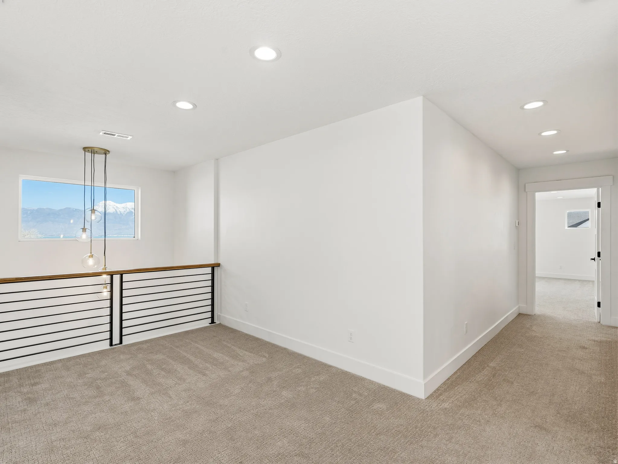 Landing for upstairs, featuring carpet floors and a mountain/lake view
