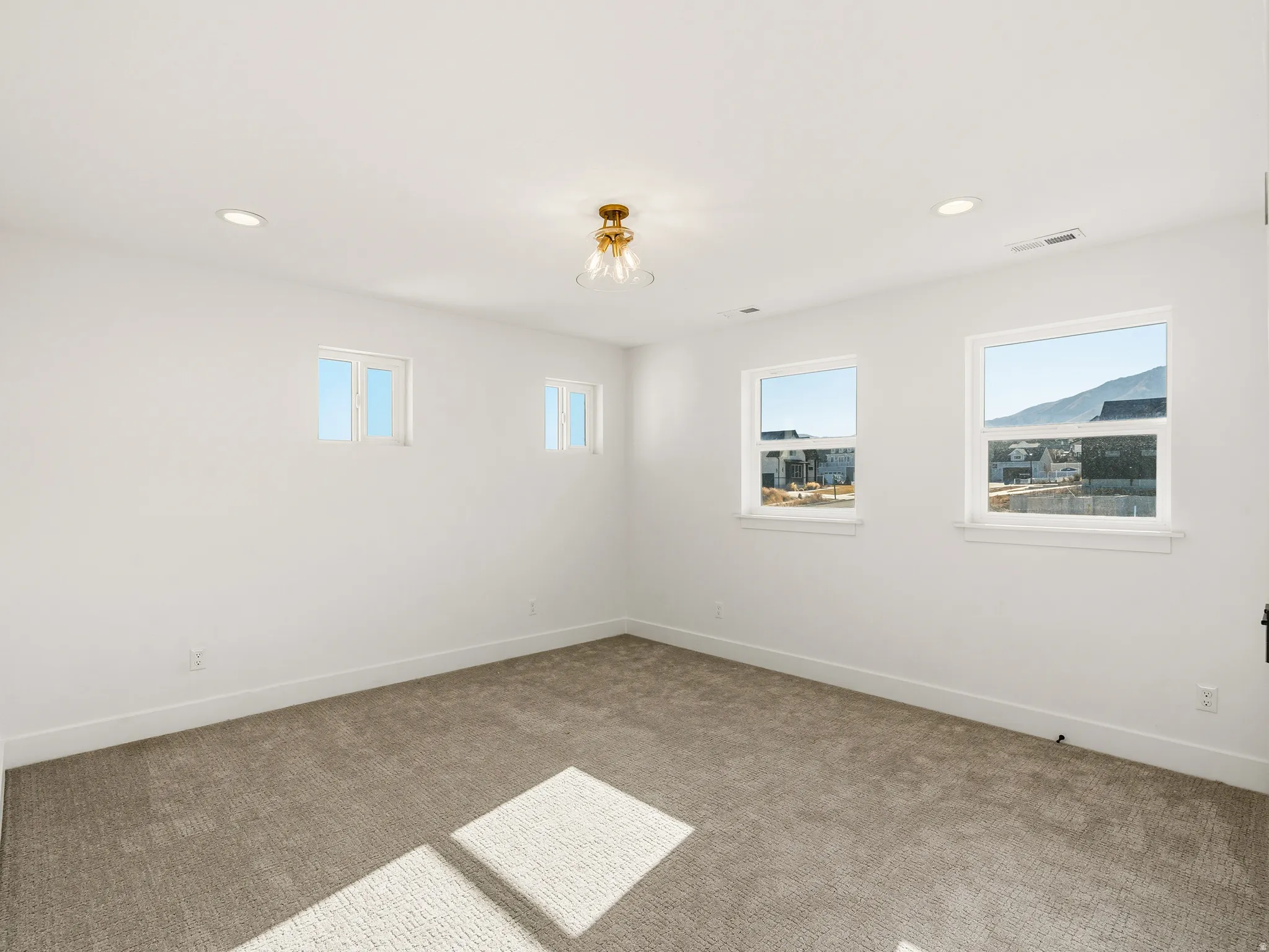 Upstairs bedroom featuring carpet floors and recessed lighting