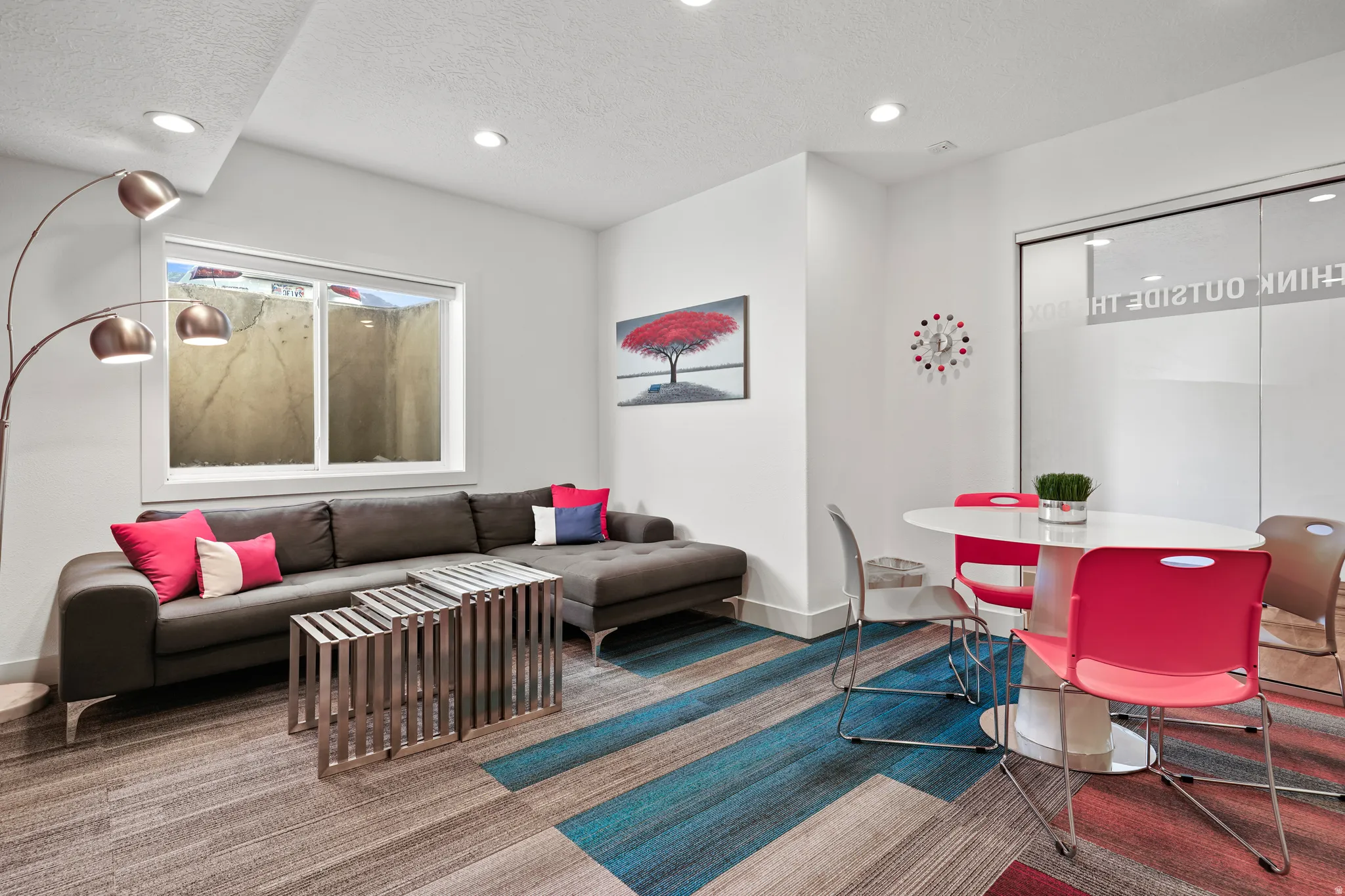 Living area with a textured ceiling and recessed lighting