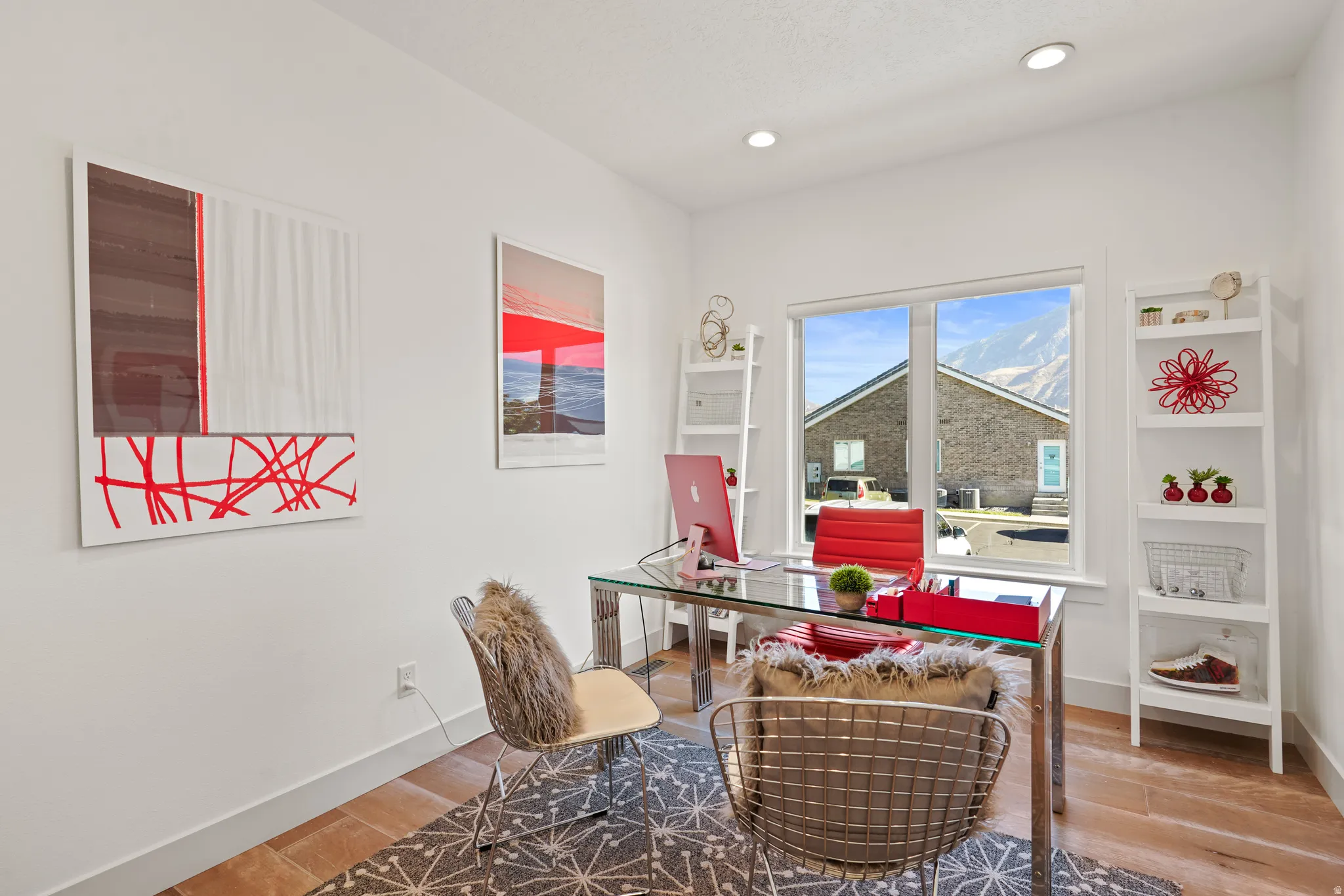 Office space featuring light wood-style flooring and recessed lighting