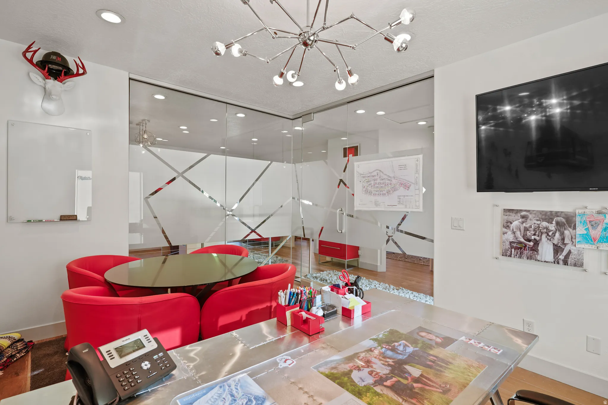 Game room featuring a chandelier
