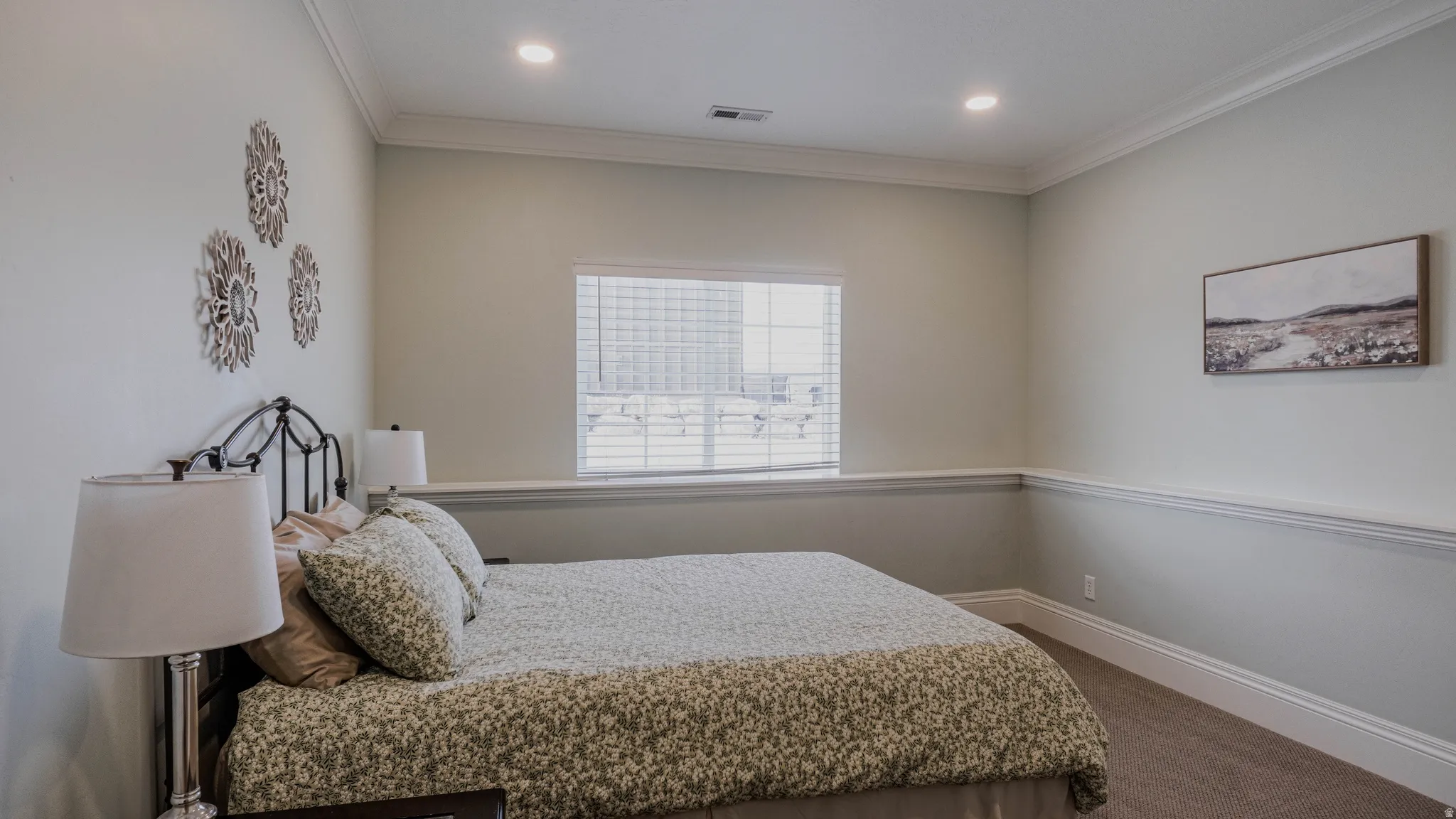 Carpeted bedroom with crown molding and recessed lighting