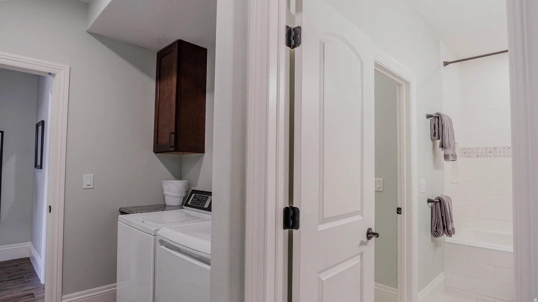 Laundry room featuring cabinet space and washing machine and clothes dryer