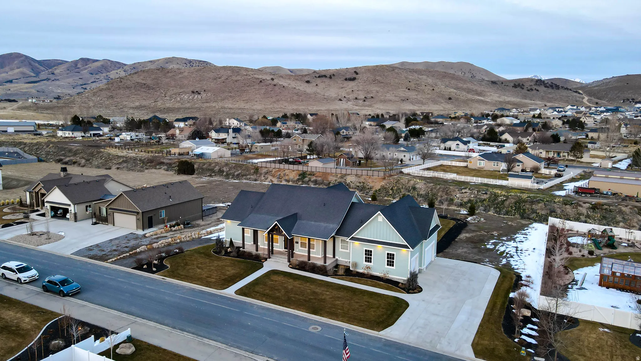Aerial view of residential area featuring mountains