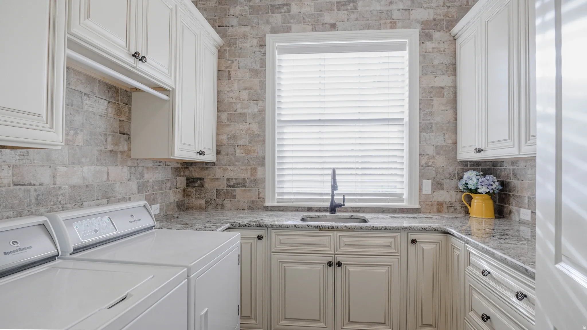 Laundry room with washer and dryer and cabinet space