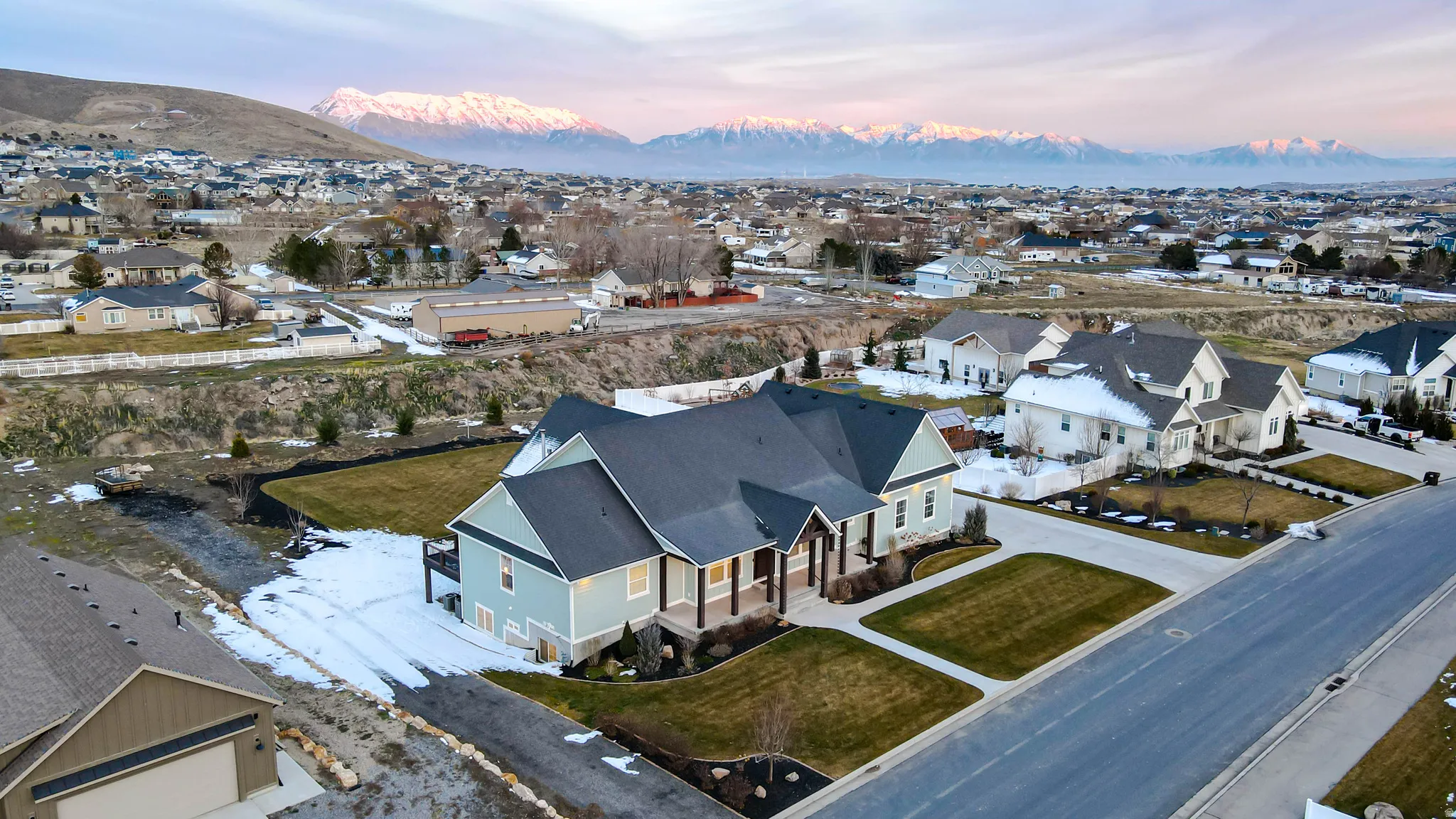 Aerial view at dusk of a residential view and a mountain view