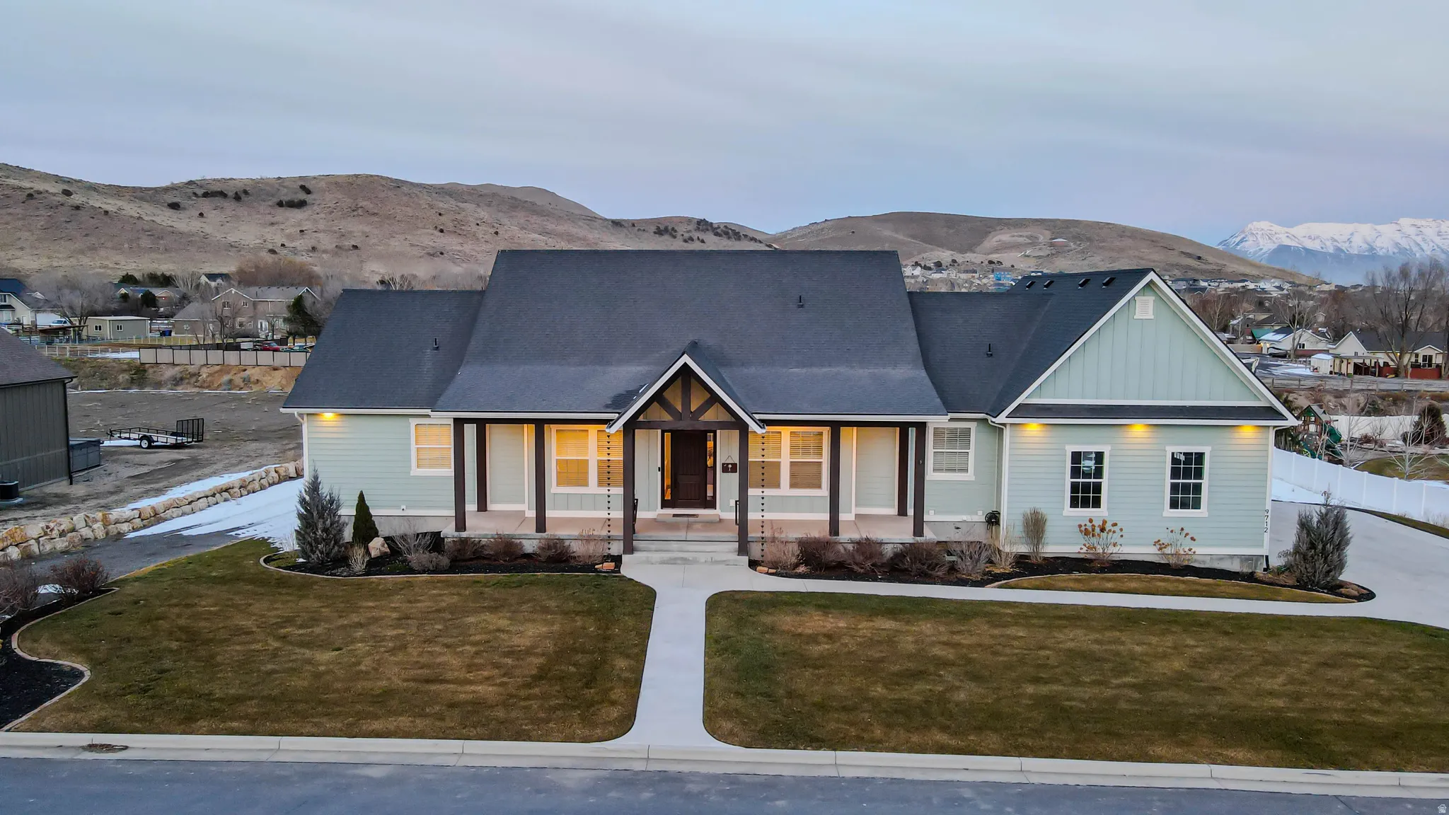 View of front of home featuring covered porch, a mountain view, and board and batten siding