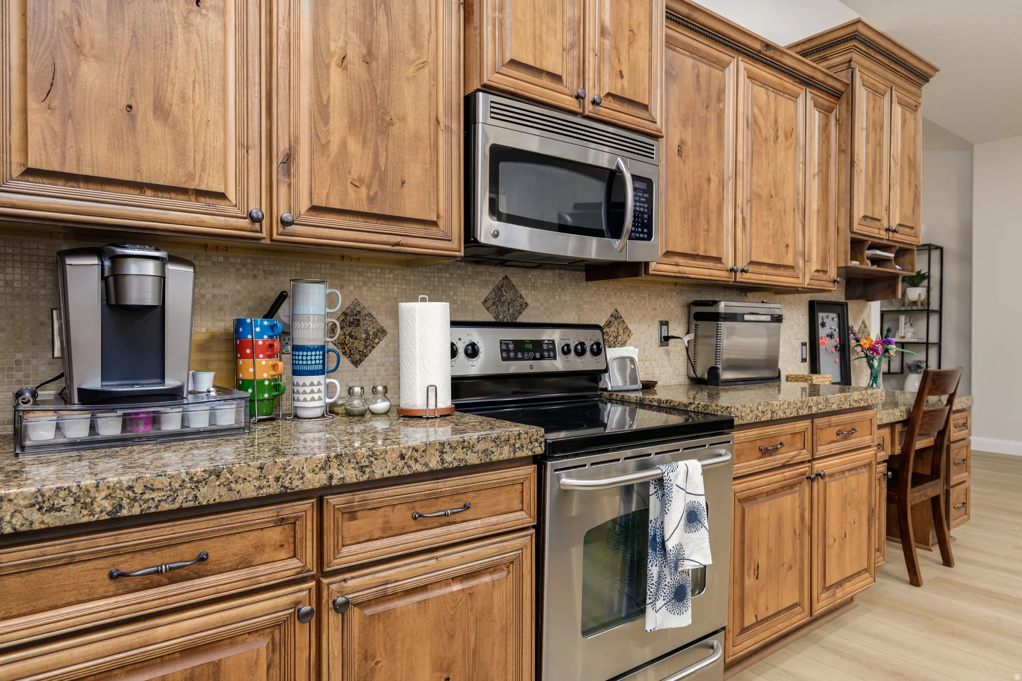 Kitchen with stainless steel appliances and wood finish cabinets