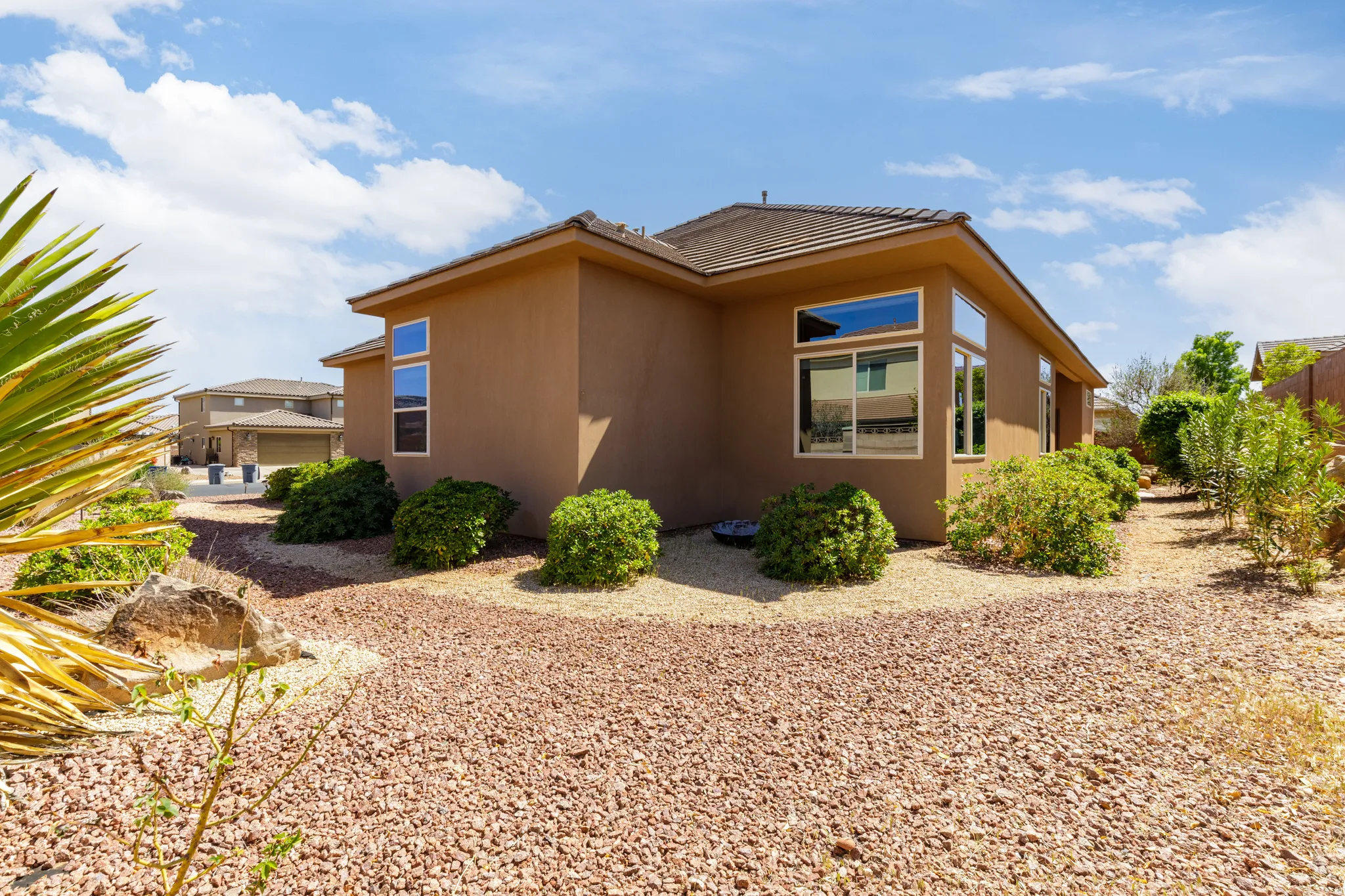 View of side of property featuring stucco siding