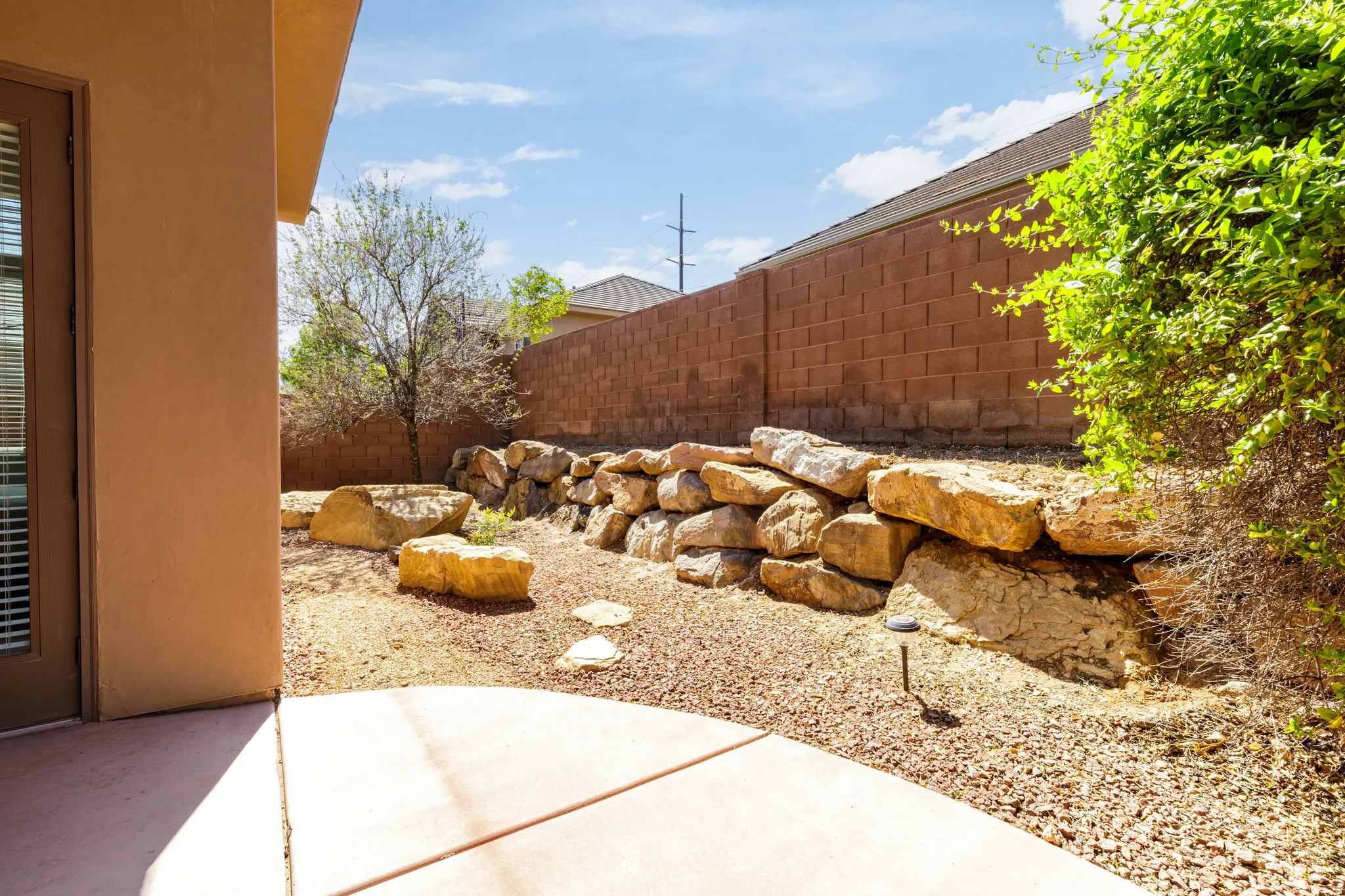 Fenced yard with a patio area