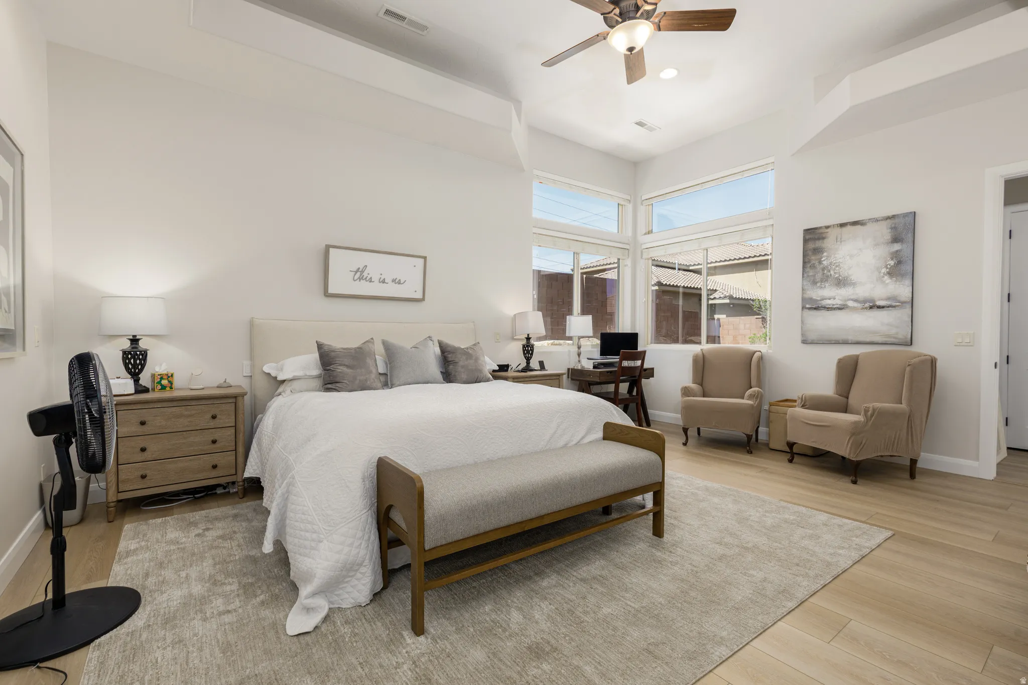 Bedroom featuring light wood-style flooring and a ceiling fan
