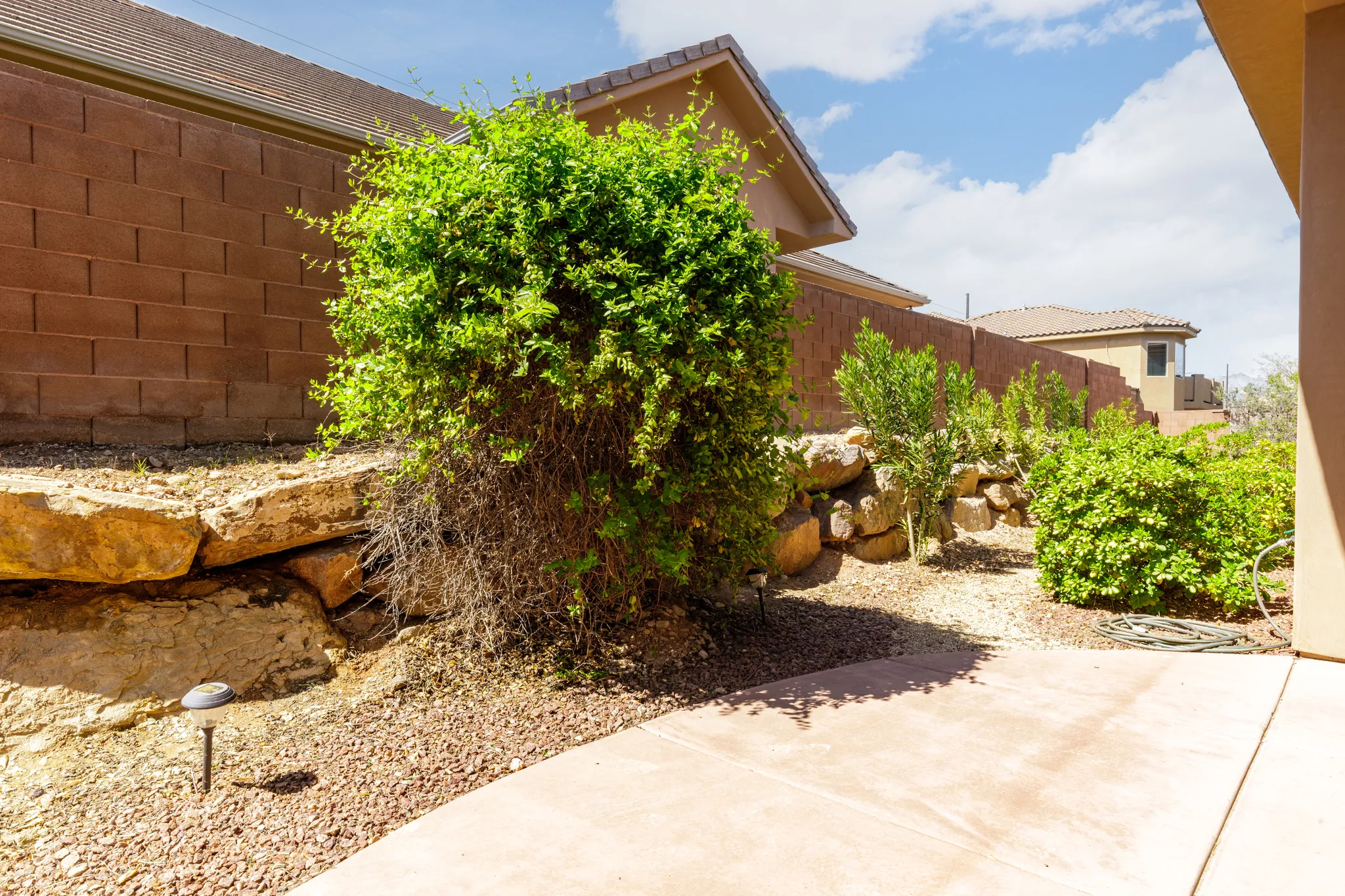 Fenced yard with a patio