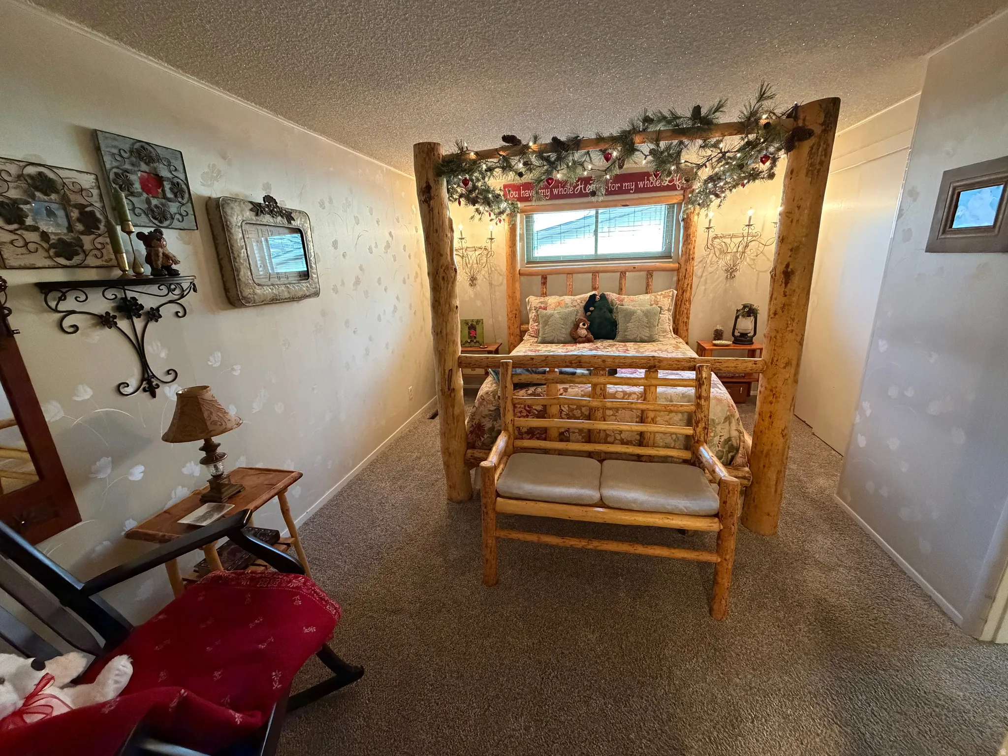 Bedroom featuring a textured ceiling and carpet