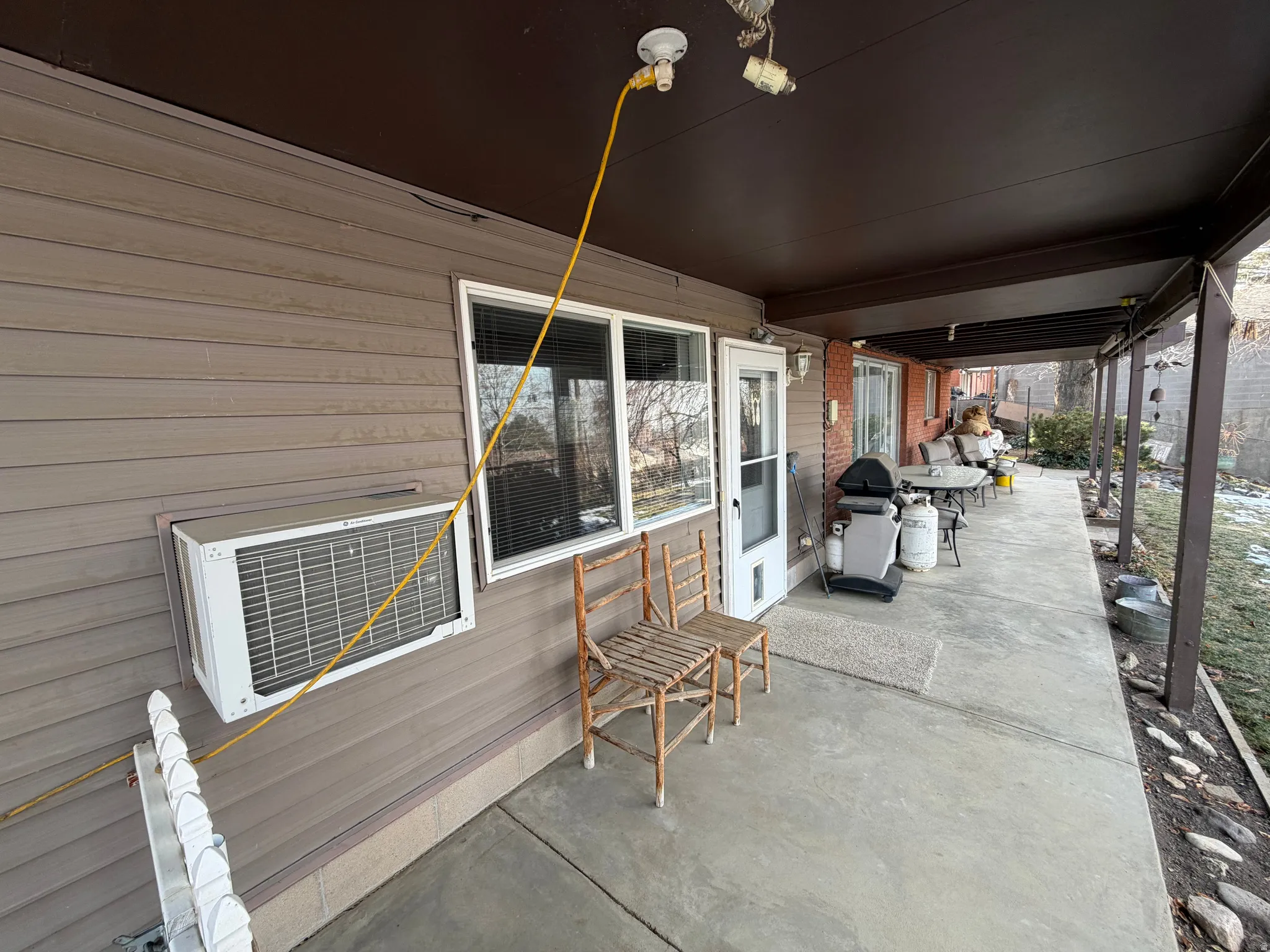 Covered porch featuring grilling area