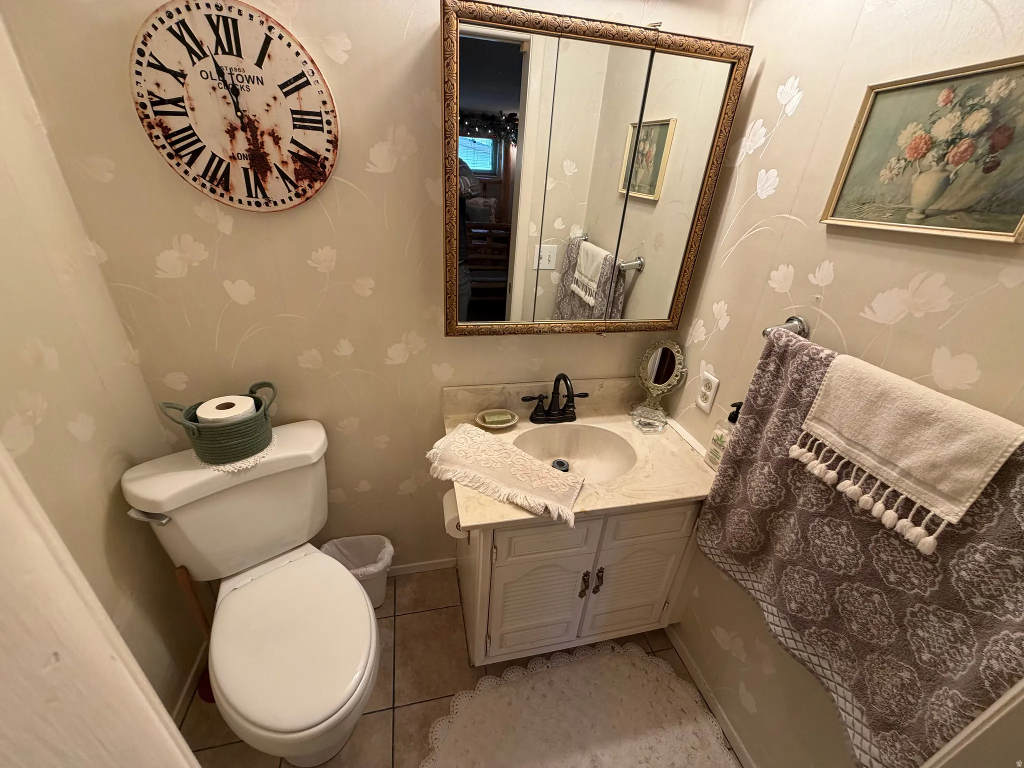 Bathroom with vanity and light tile patterned flooring