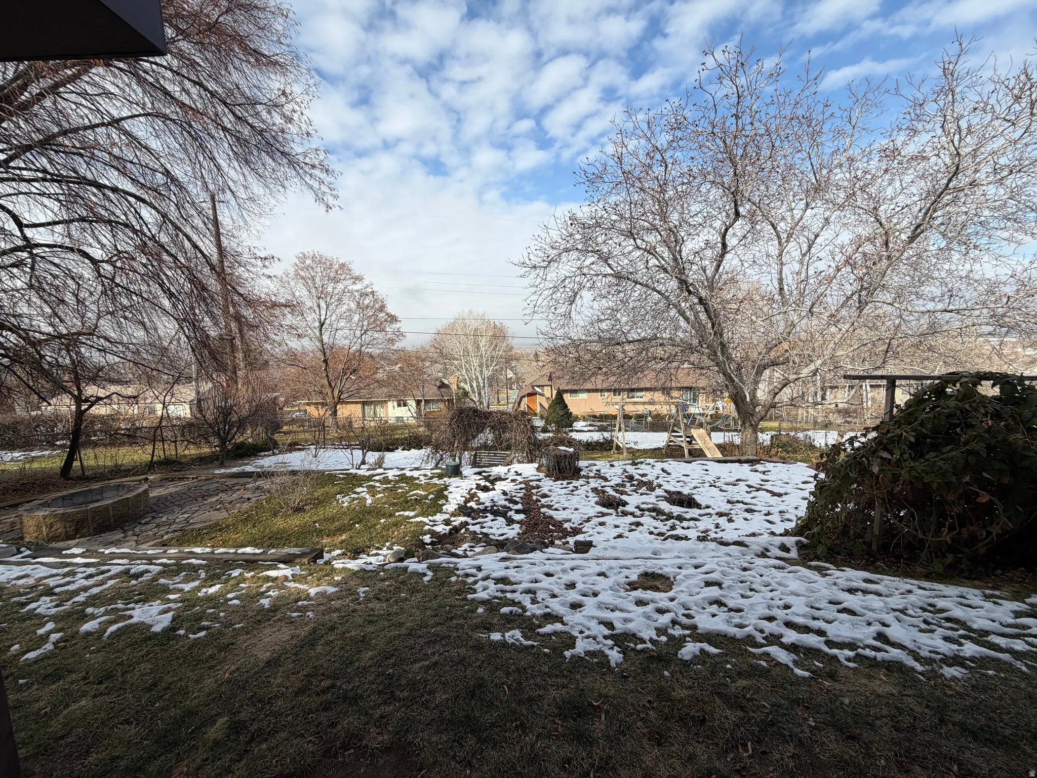 View of yard covered in snow
