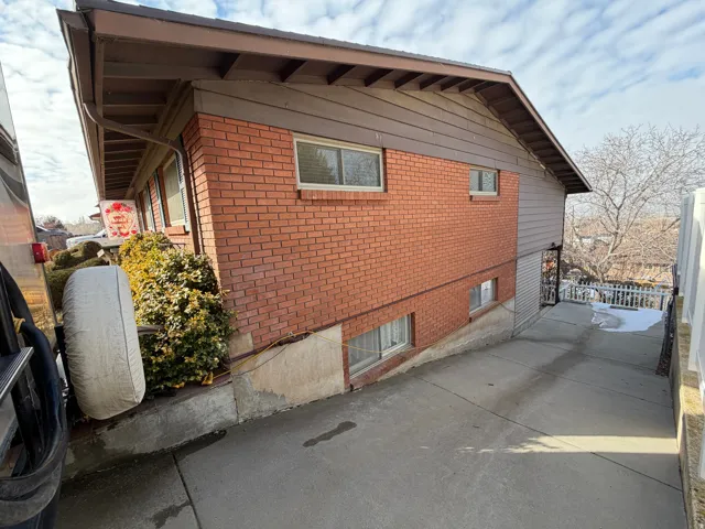 View of side of property with brick siding