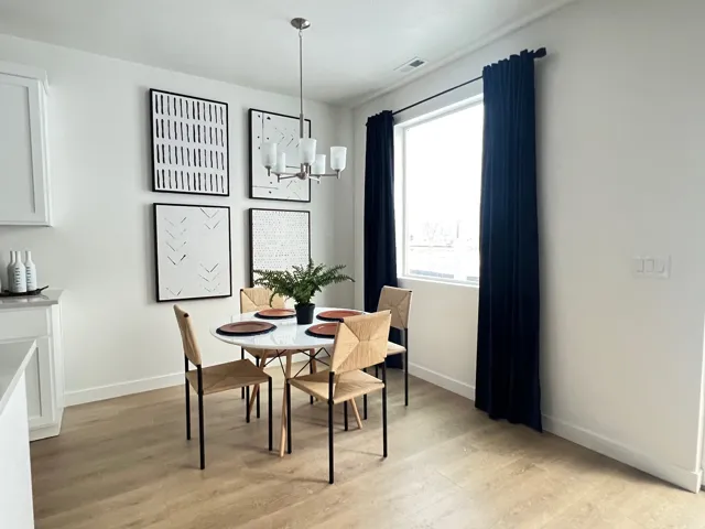 Dining room featuring a chandelier and light wood finished floors