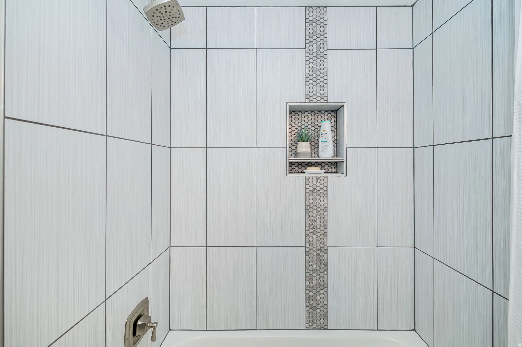 Bathroom view of tub / shower combination