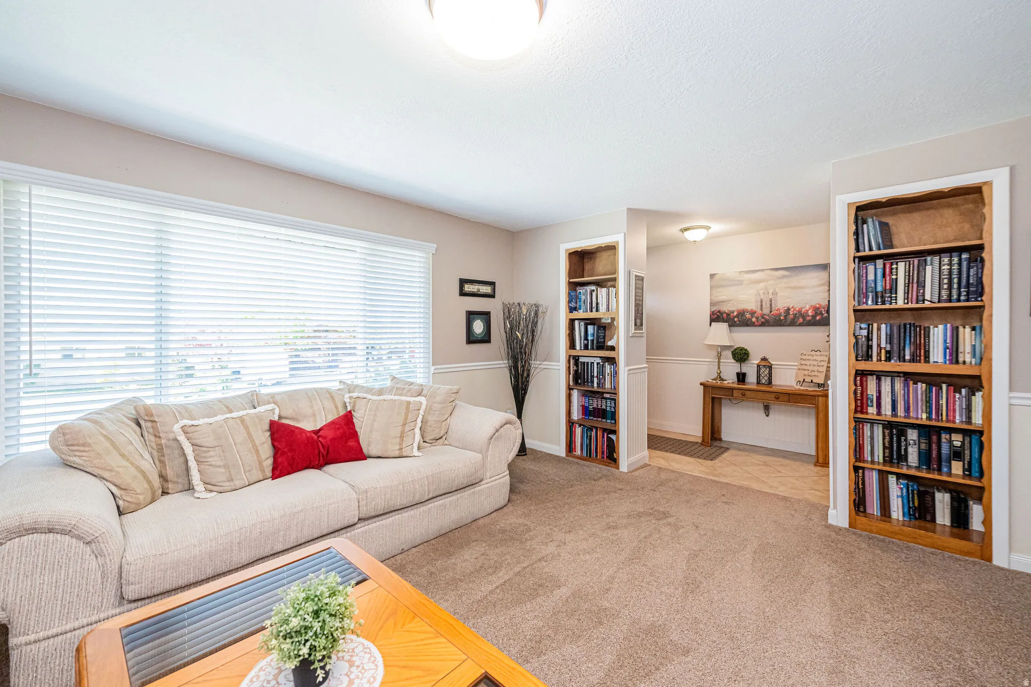 Living room with built in features and carpet flooring