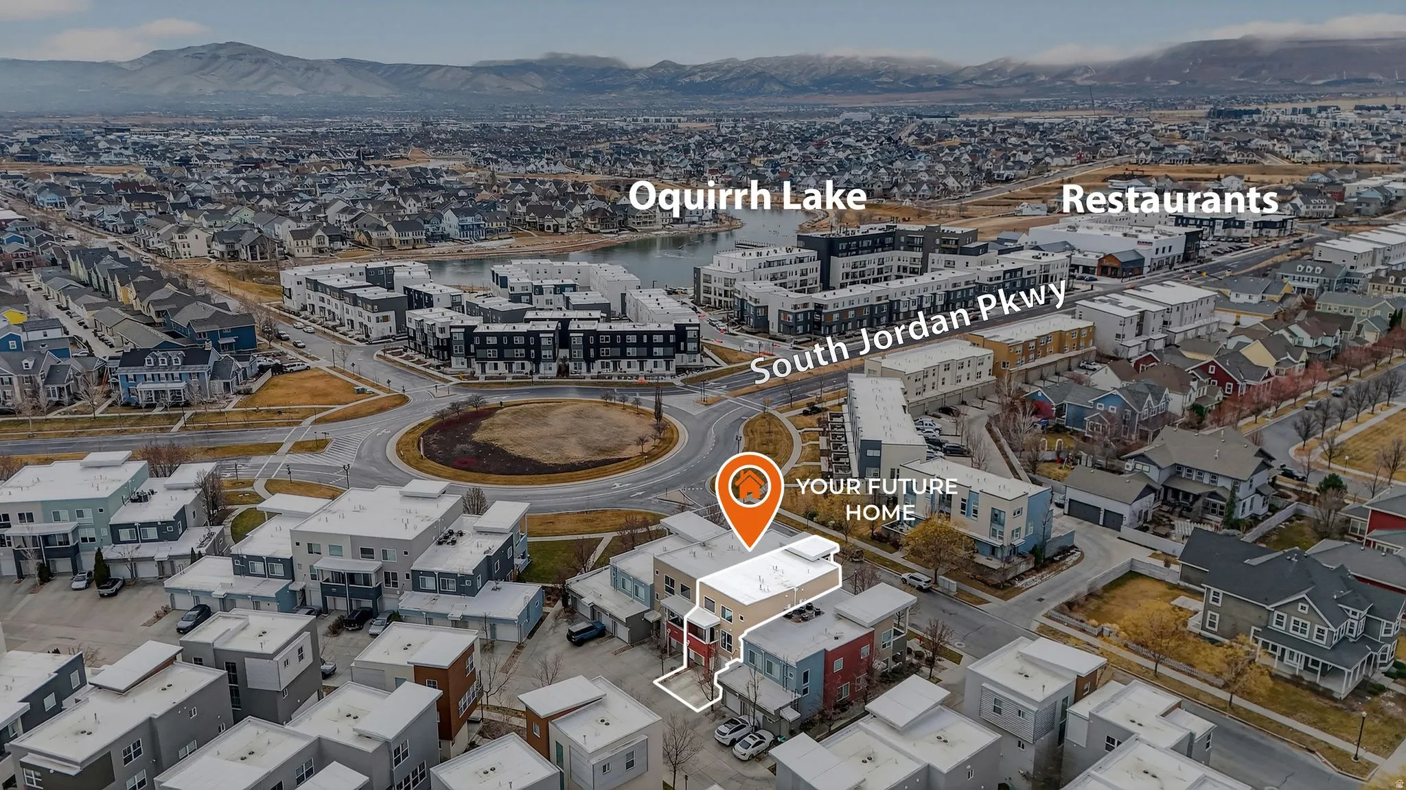 Aerial view of property's location featuring a mountainous background
