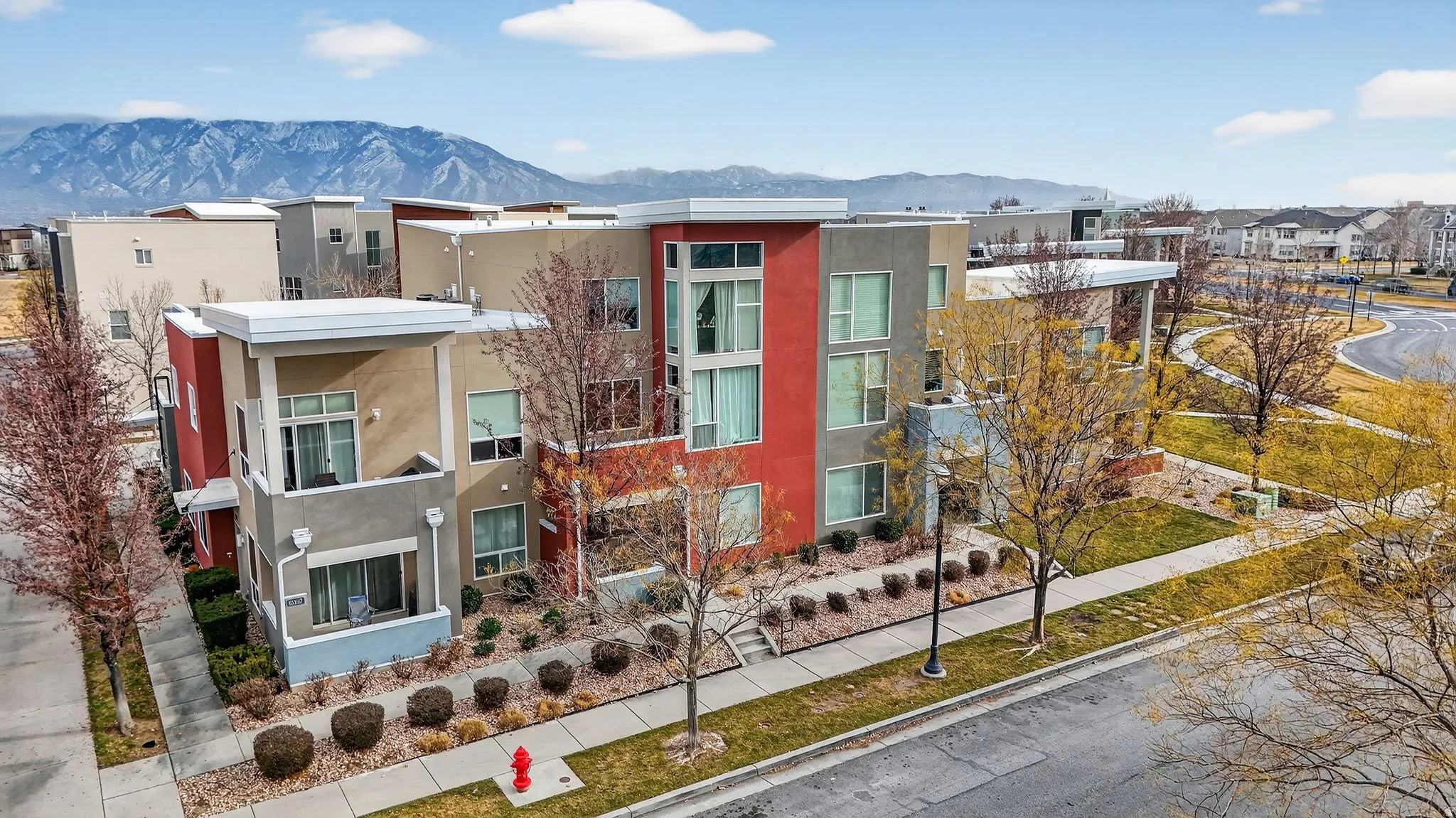 View of property with a mountain view and a residential view