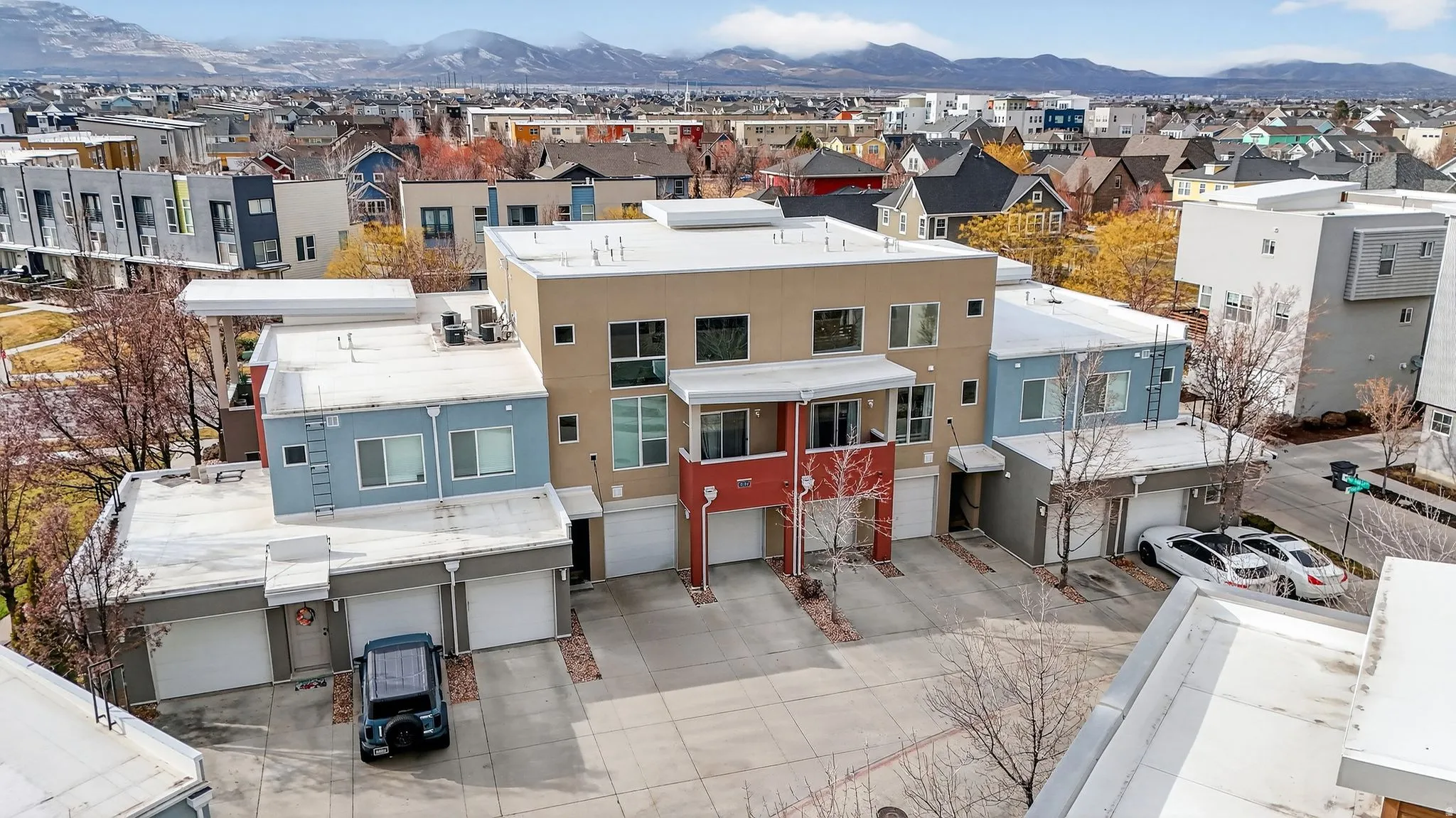 Aerial view of residential area with a mountainous background