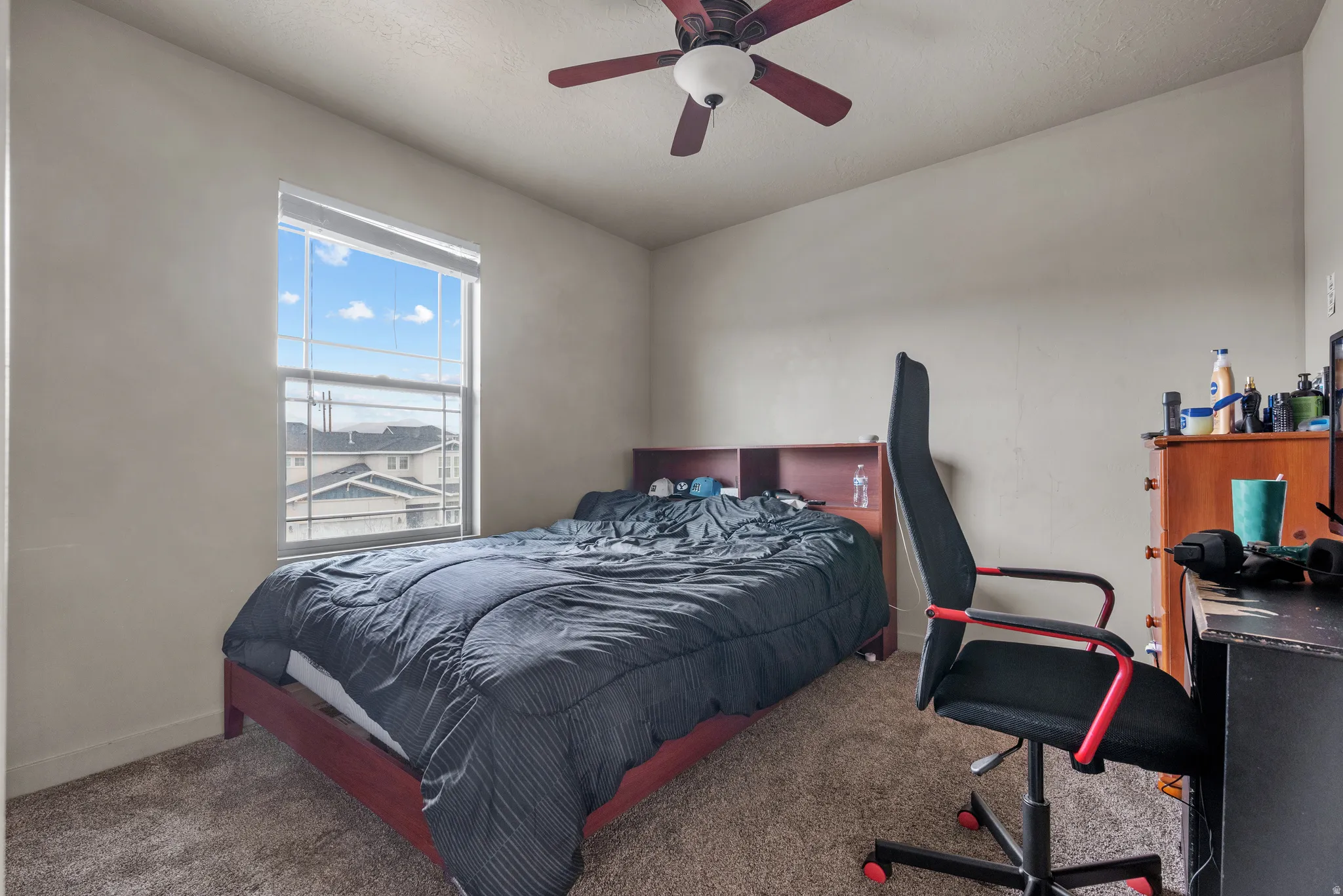 Bedroom featuring carpet floors and ceiling fan