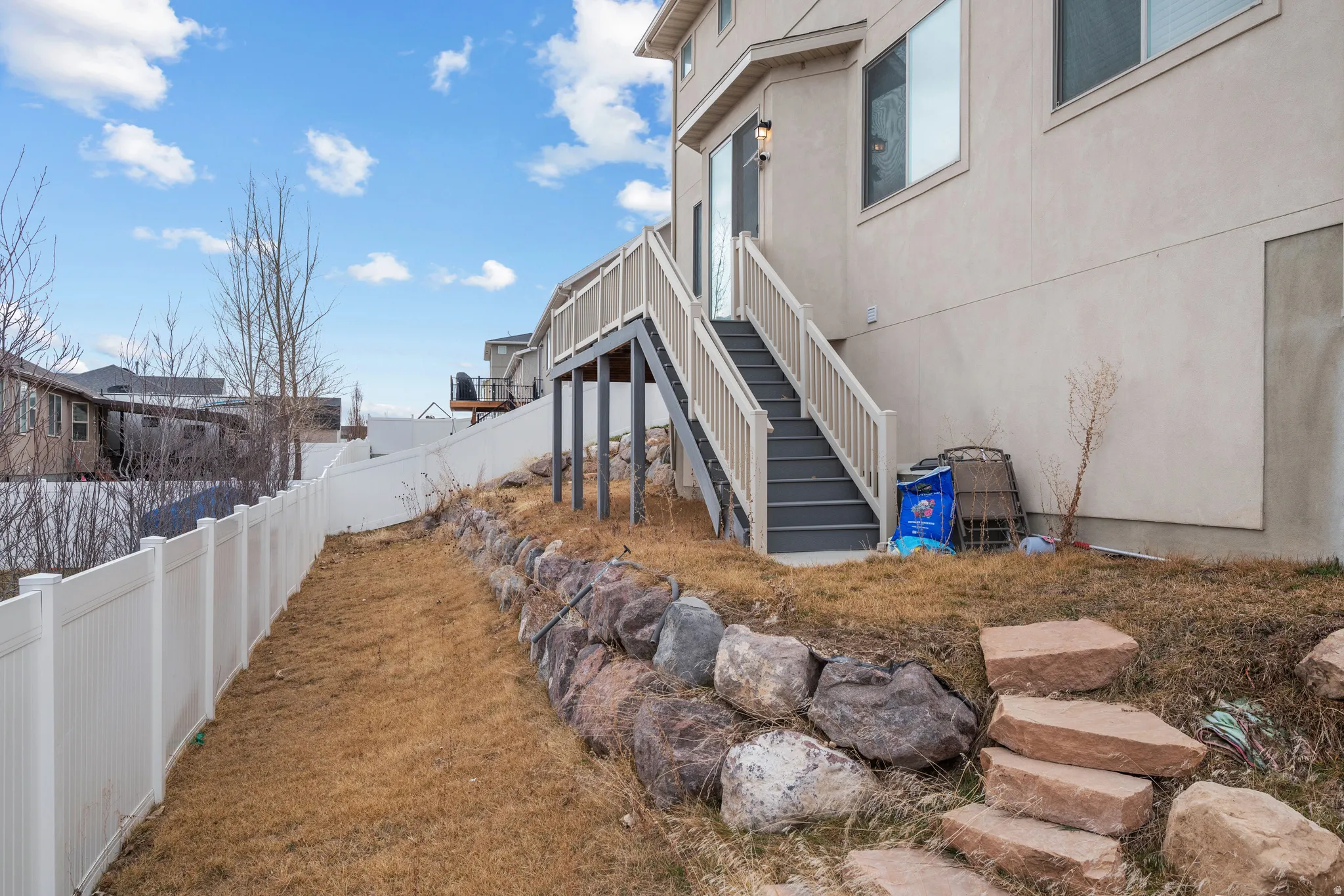View of side of home featuring stucco siding