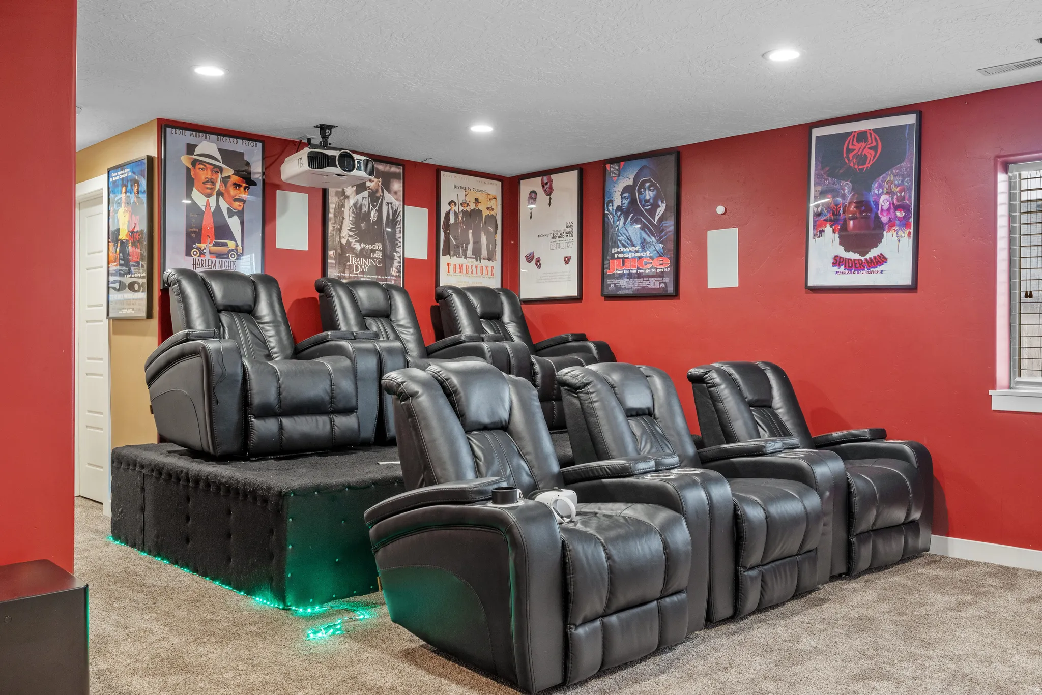 Home theater room with light carpet, recessed lighting, and a textured ceiling