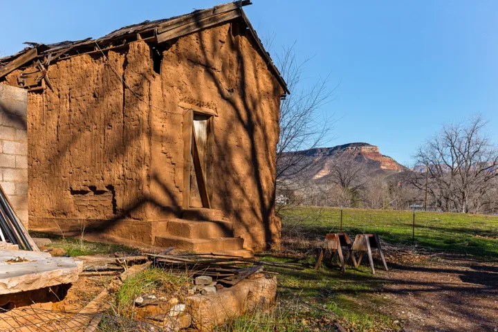 View of side of property featuring a mountain view and an outbuilding