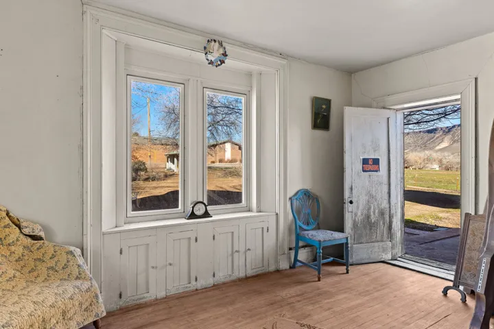 Entryway with hardwood / wood-style floors, a mountain view, and plenty of natural light