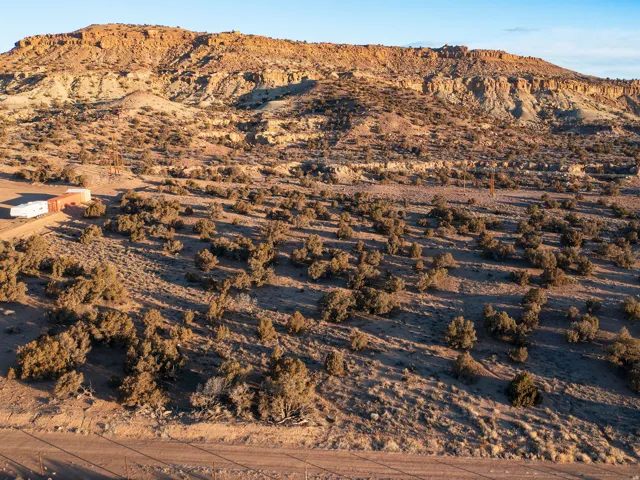 View of mountain backdrop with a desert landscape and rural landscape