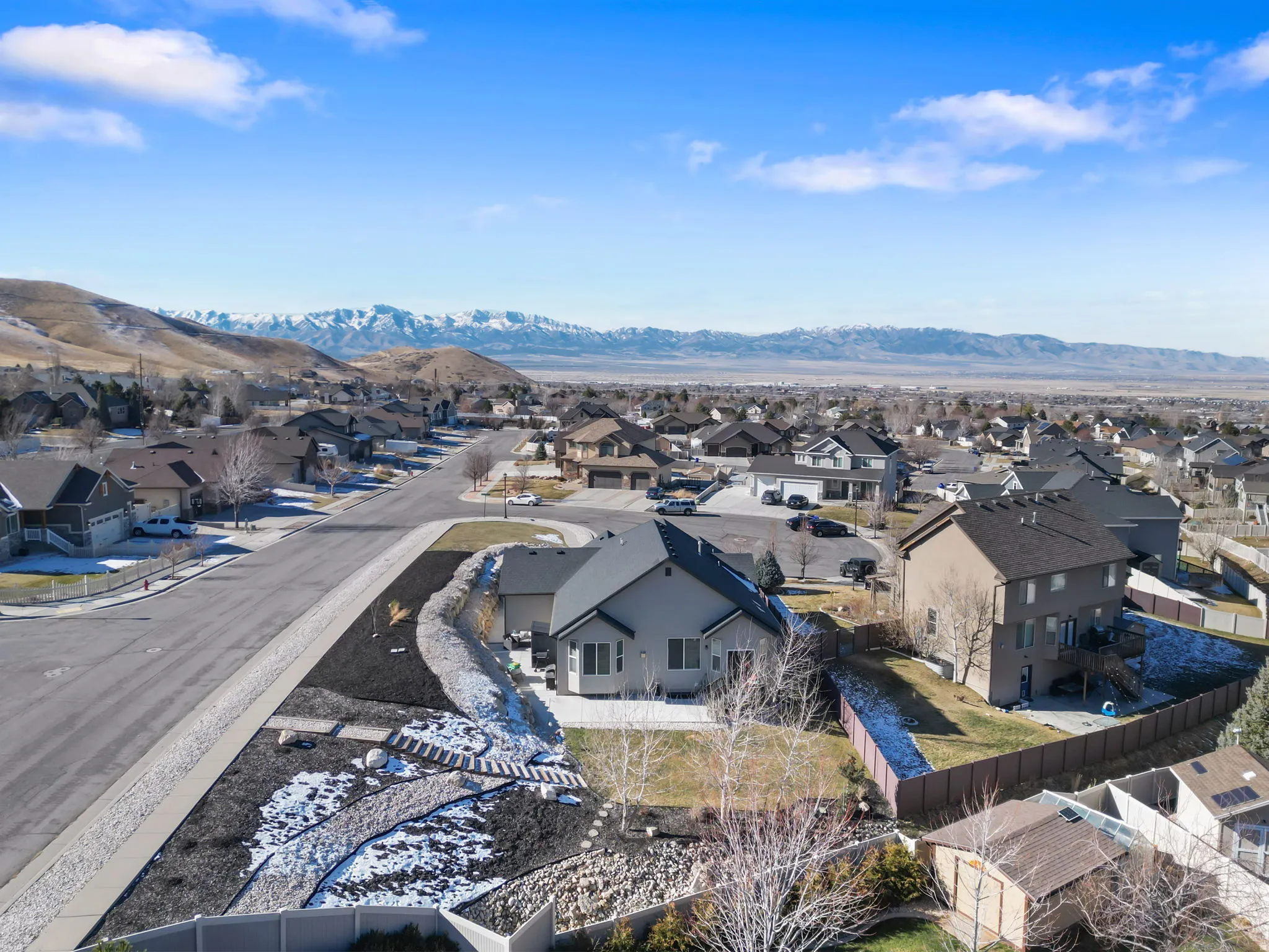 Aerial view of residential area featuring mountains