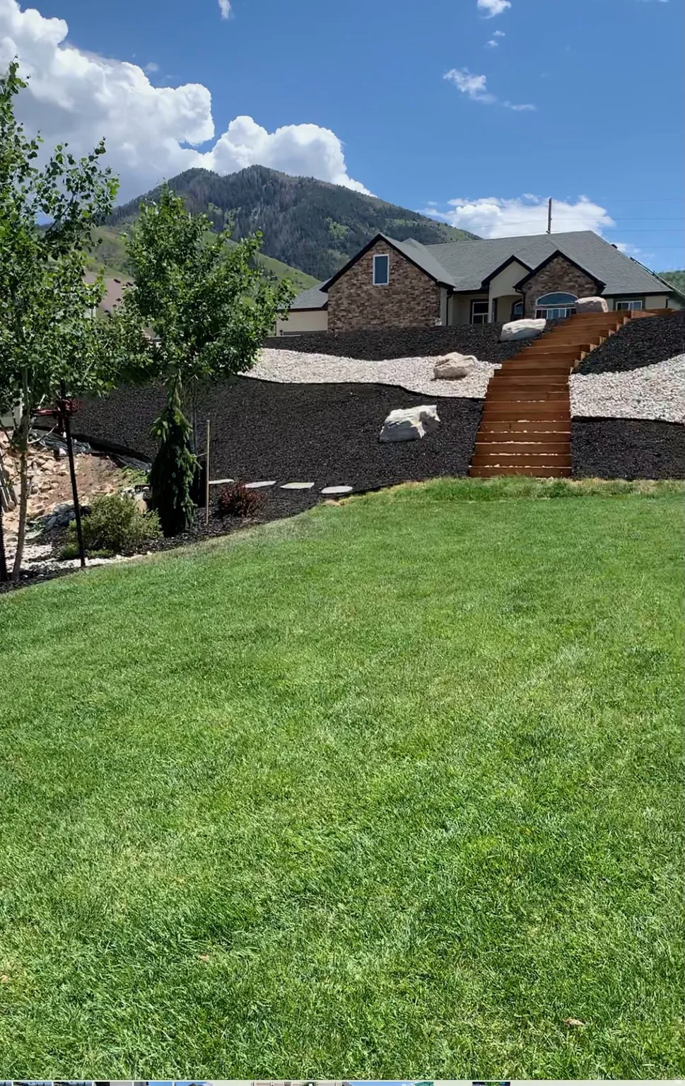 View of grassy yard featuring a mountain view