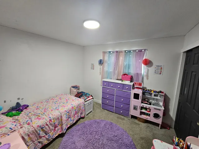 Bedroom featuring carpet floors