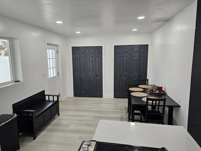 Foyer featuring recessed lighting, light wood finished floors, and a textured ceiling