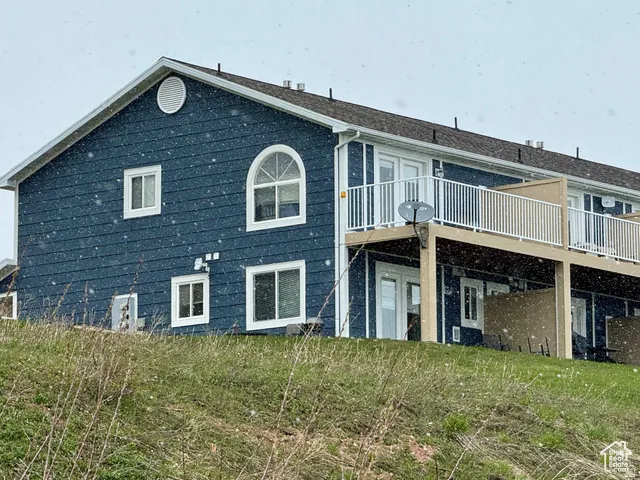 South side of property with a deck and patio