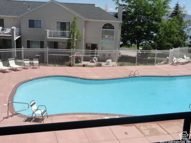 Harbor Village pool featuring a patio area