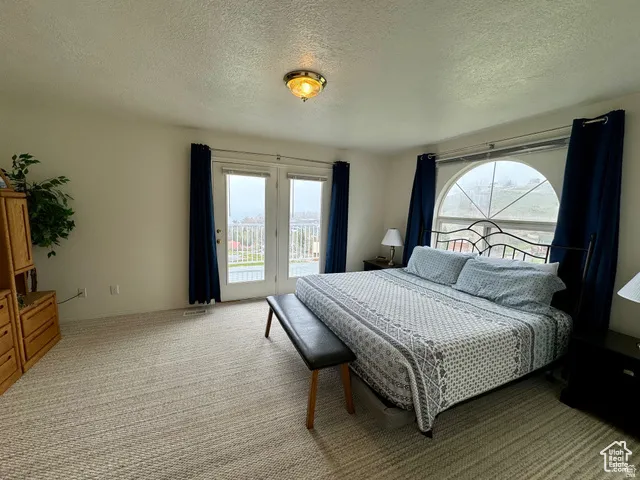 Primary Bedroom access to exterior deck, and extra light with end unit
