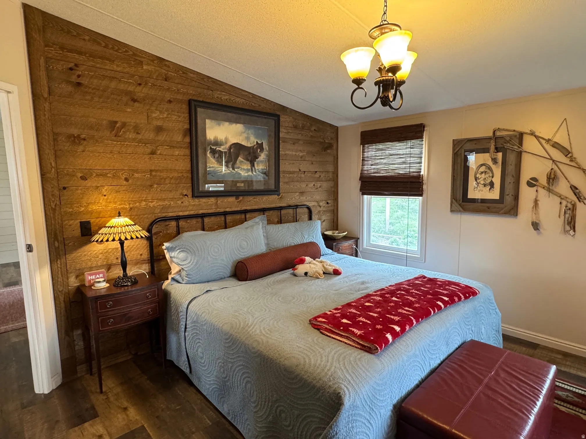 Bedroom with wooden walls, LVT flooring,