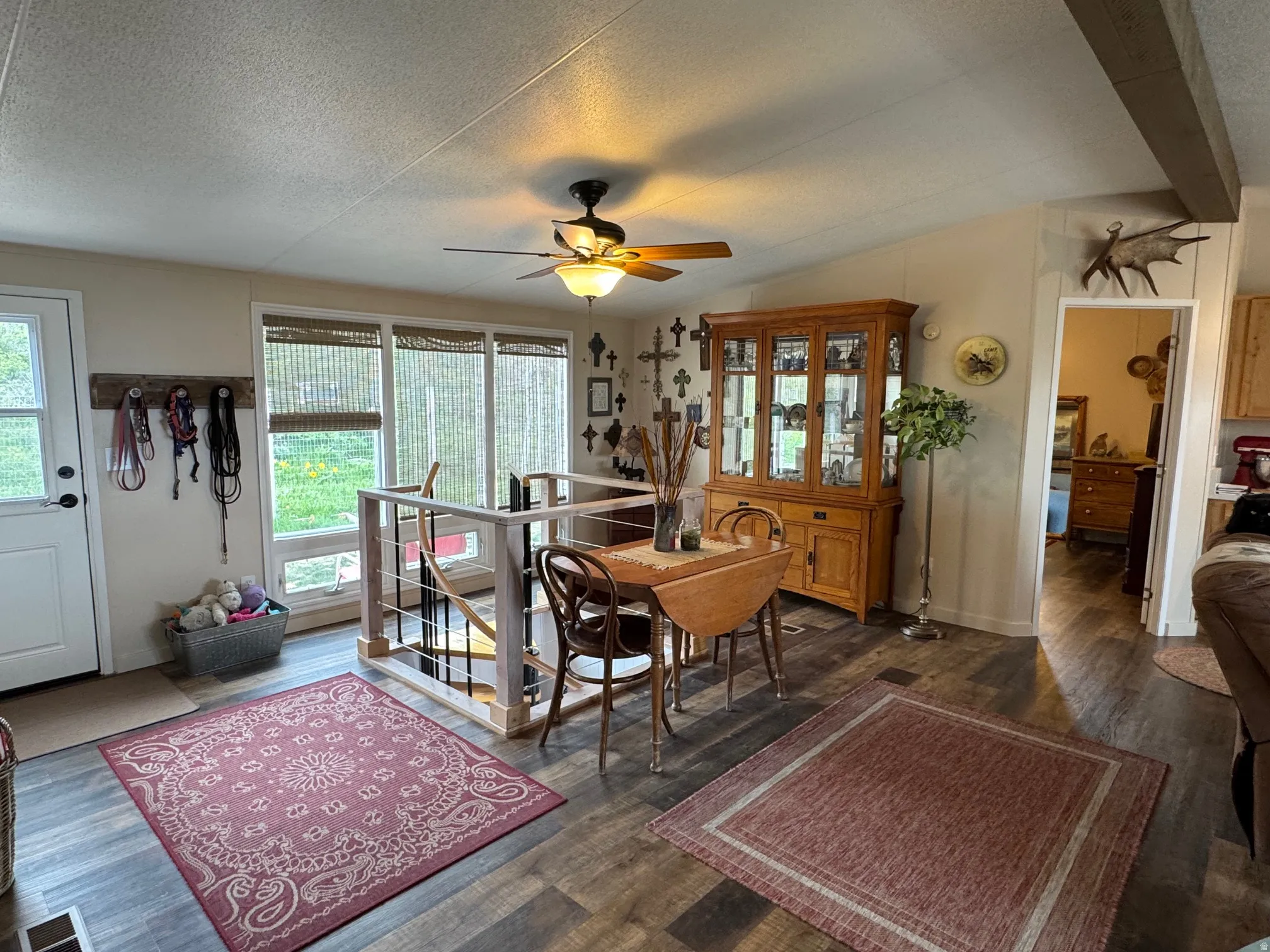Living room area with shiplap walls and LVT flooring