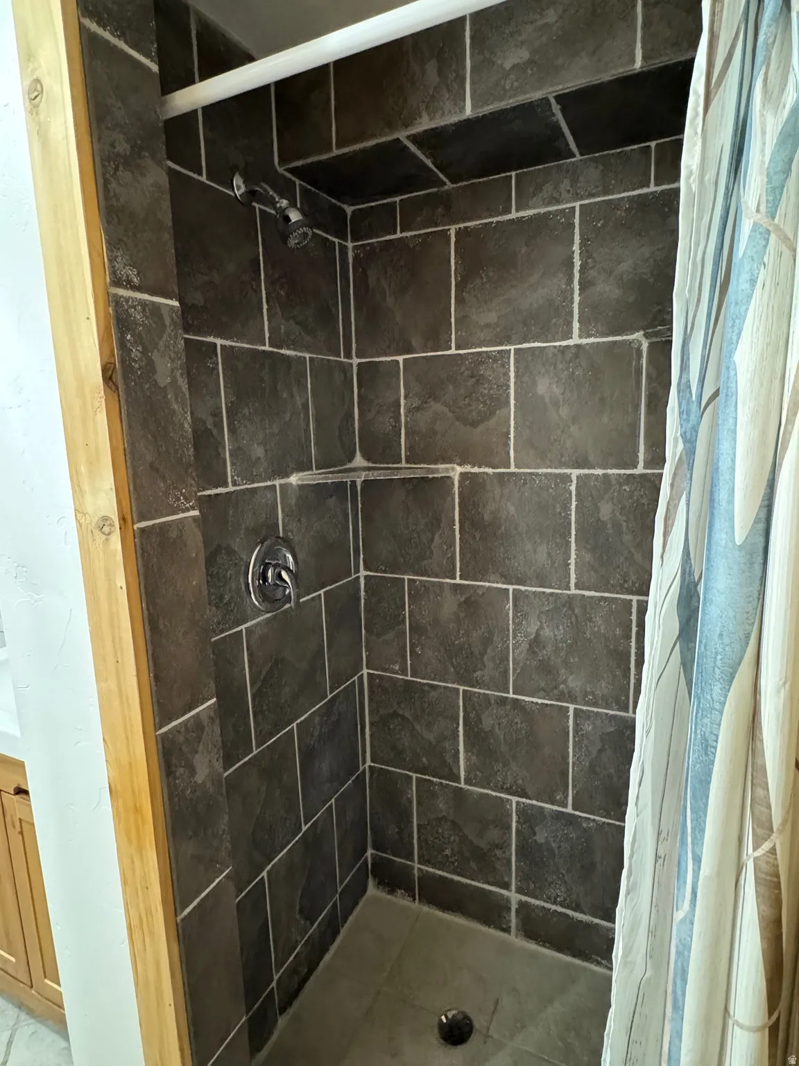 Full bath with a shower stall