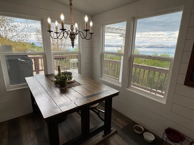 Dining room with LVT flooring, lake view