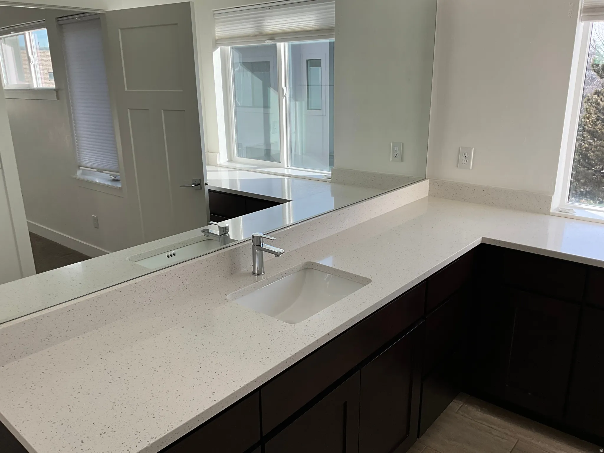 Bathroom featuring vanity and light wood-style floors