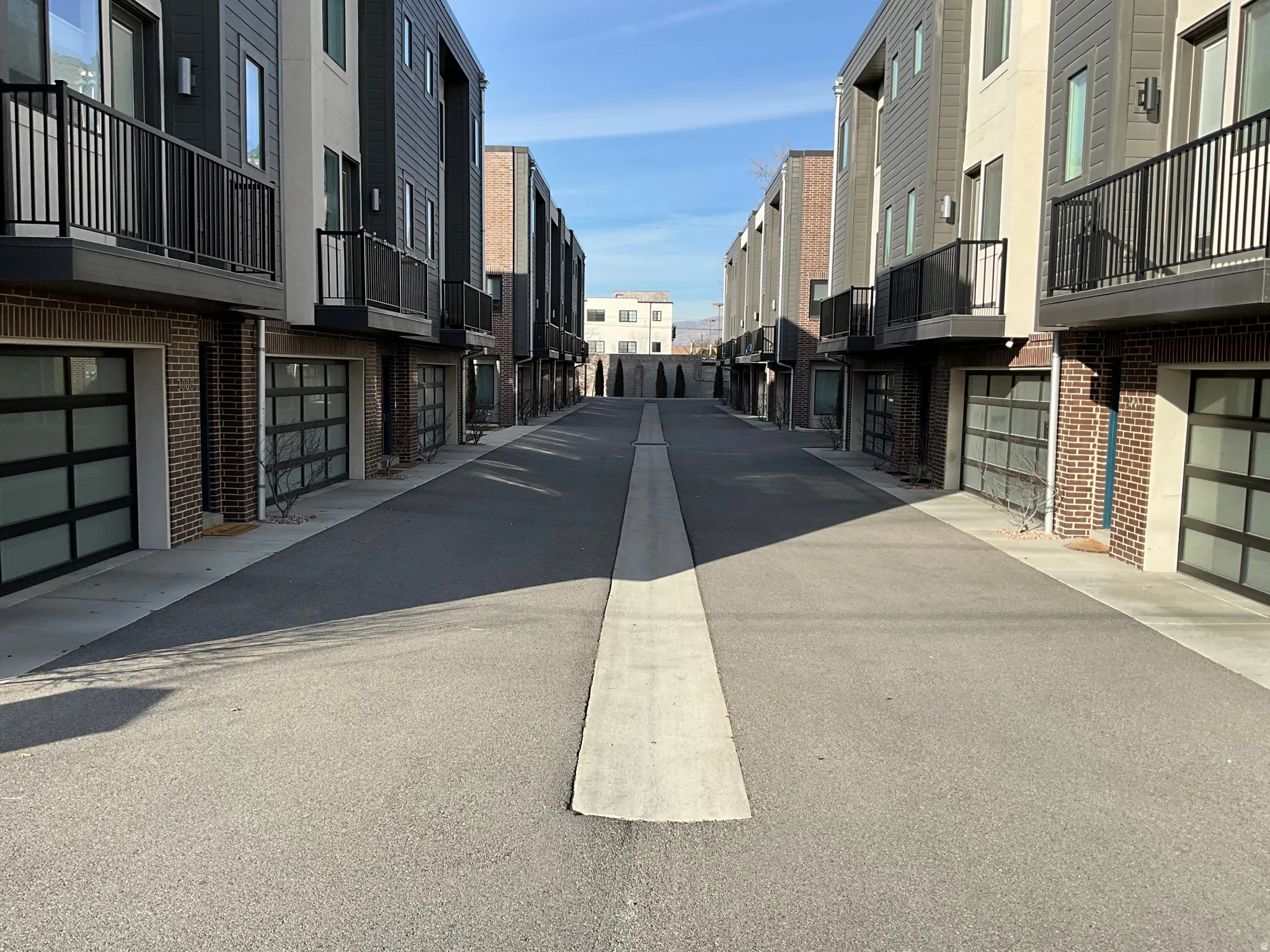 View of asphalt alley