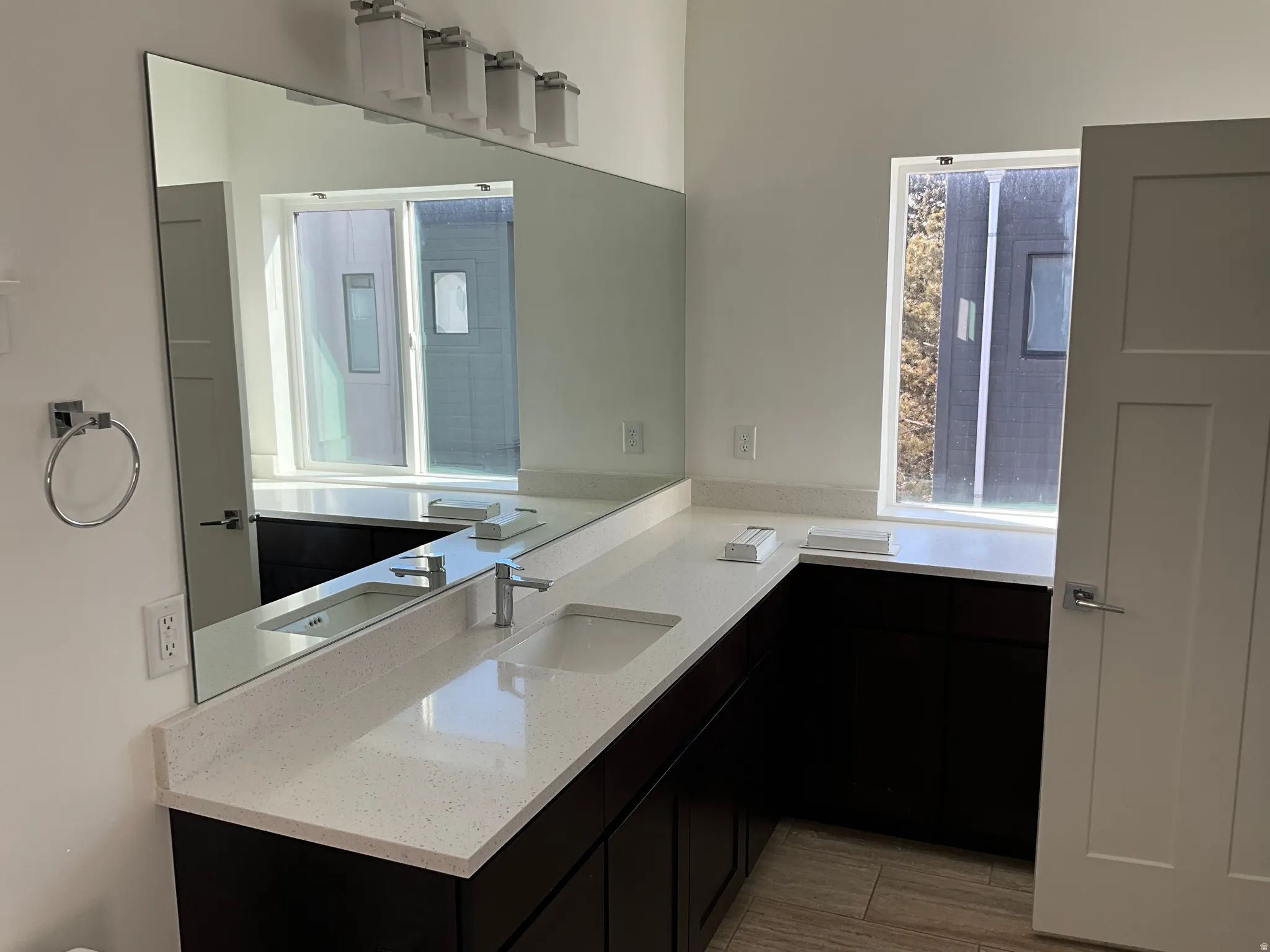 Bathroom featuring vanity and light wood finished floors